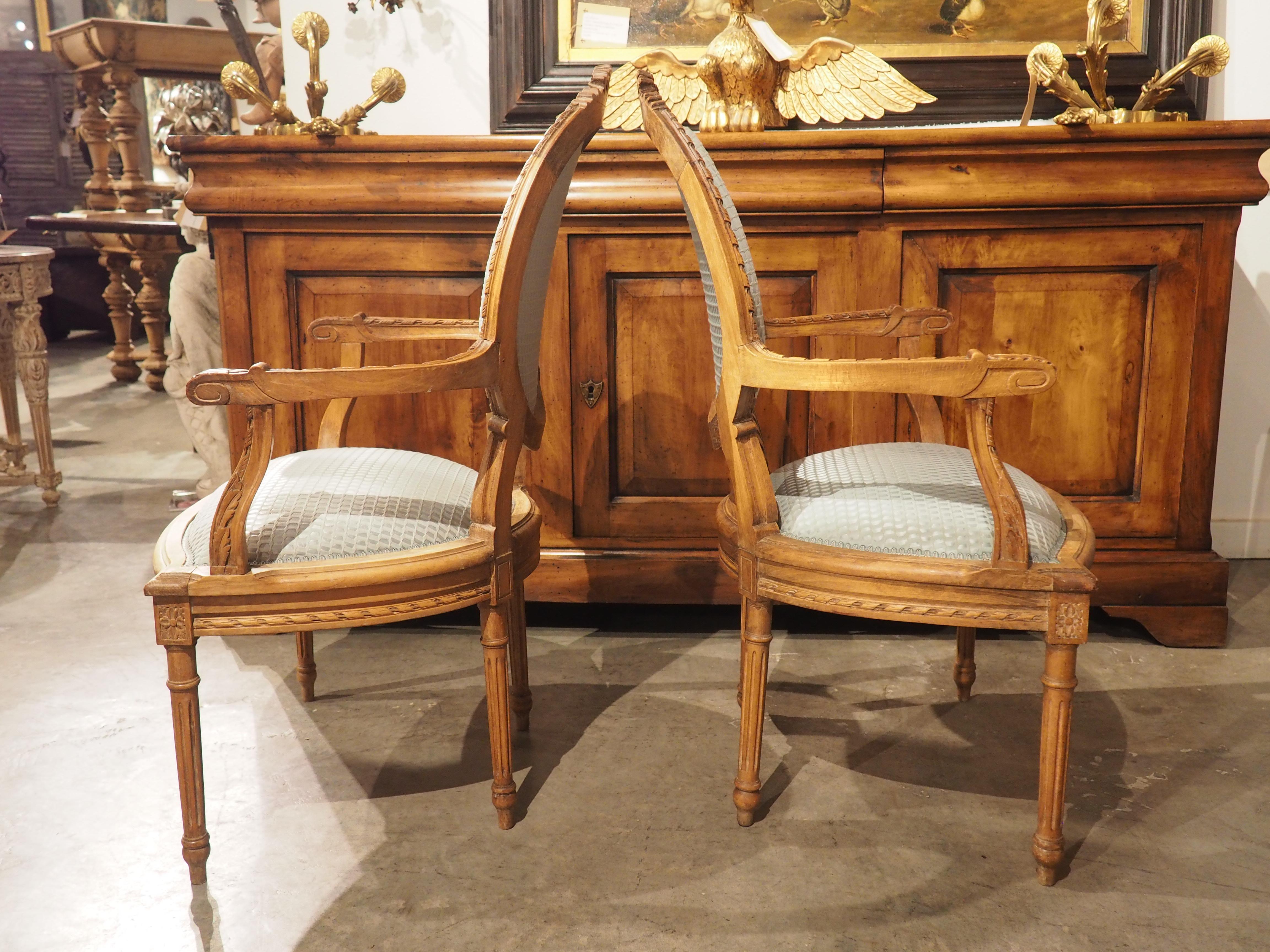 Pair of French Louis XVI Style Beechwood and Blue Silk Cabriolet Armchairs For Sale 13