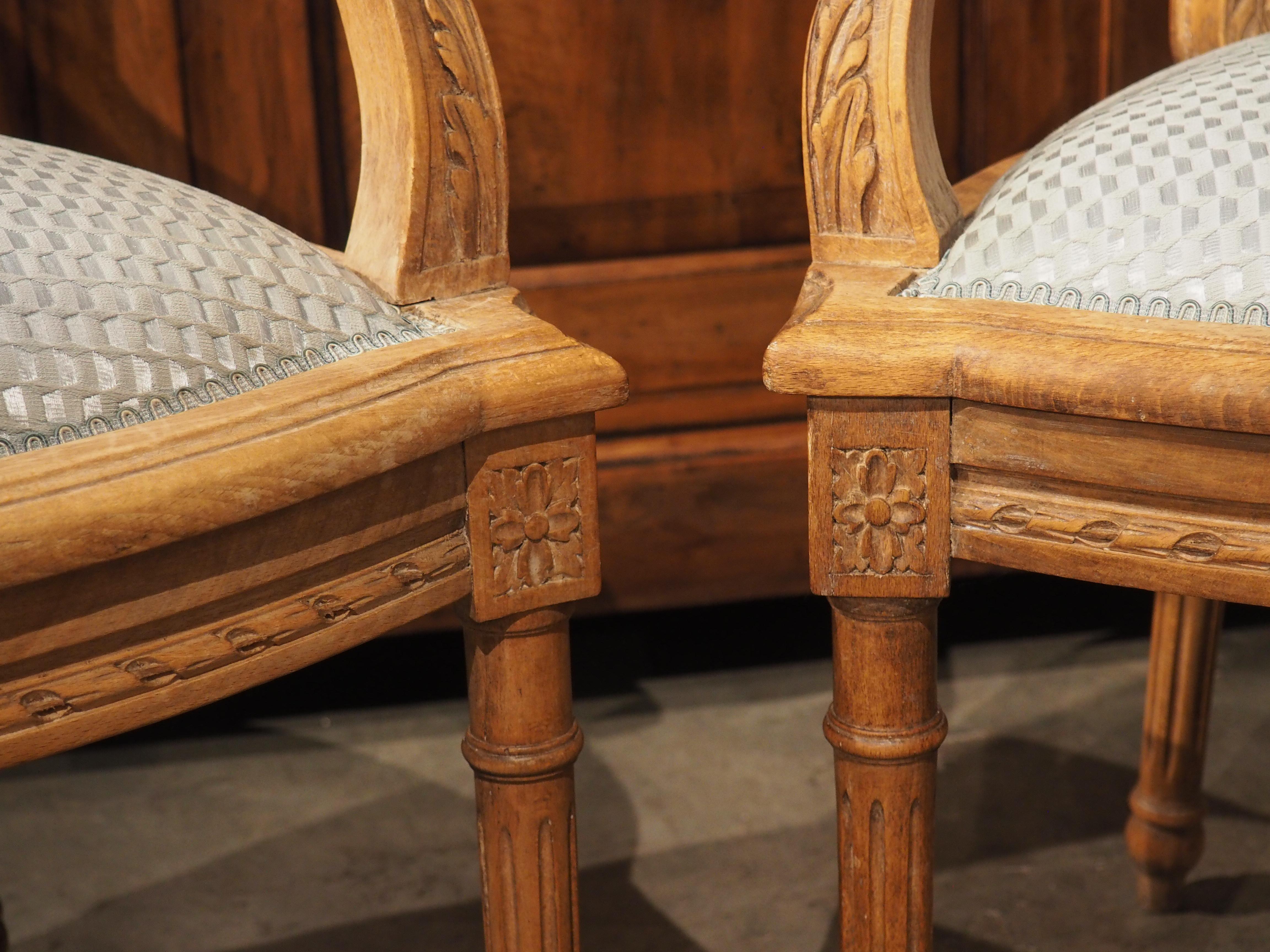 Pair of French Louis XVI Style Beechwood and Blue Silk Cabriolet Armchairs For Sale 1