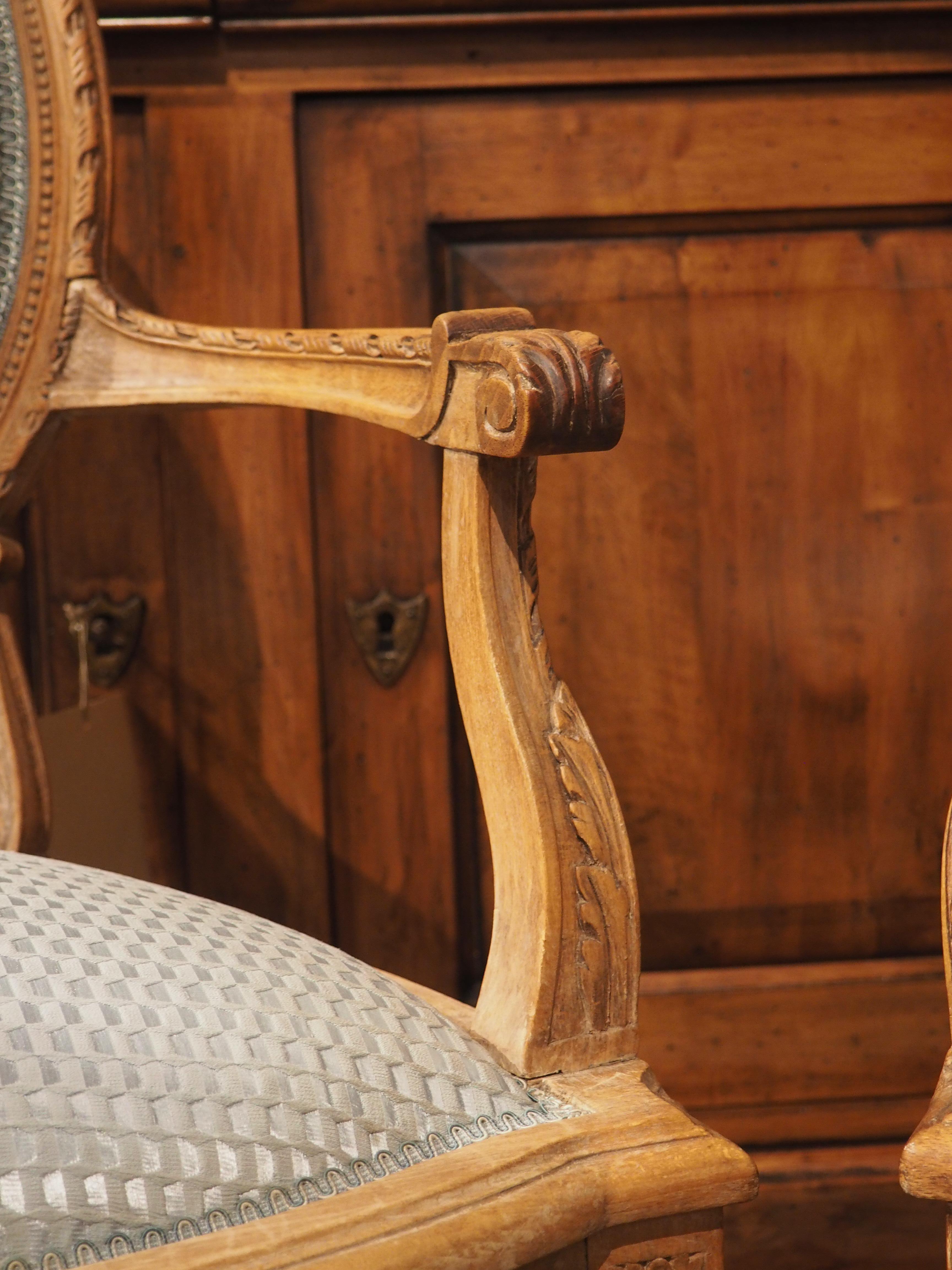 Pair of French Louis XVI Style Beechwood and Blue Silk Cabriolet Armchairs For Sale 2