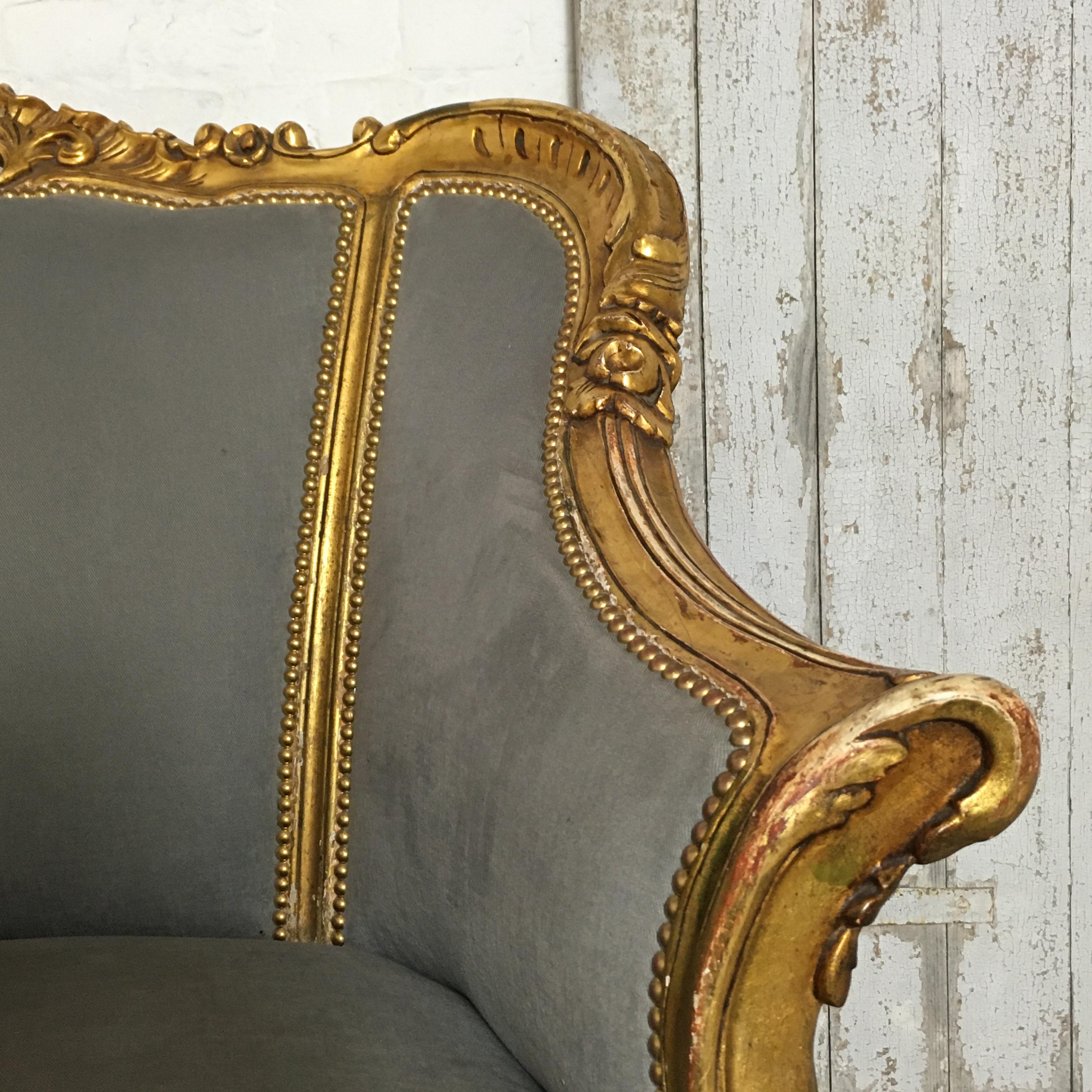 Pair of French Louis XVI style bergère chairs
Beautifully carved and gilded wooden frames, some of the gilt has worn with age and use
The chairs have been re-upholstered, the straw inner is still in place at the wings, back and arms of the