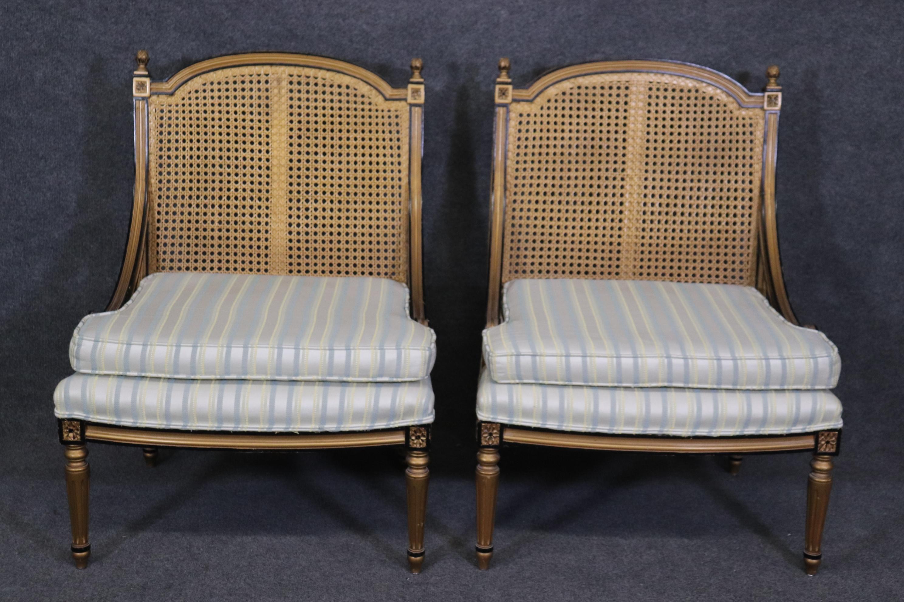 Dimensions- H: 34 1/4in W: 25 3/4in D: 24in SH: 17 1/4in 
This Pair of French Louis XVI Style Cane Back Bergeres, Lounge Chairs are perfect for you and your home and are a lovely example of high quality furniture from the late 20th century! If you