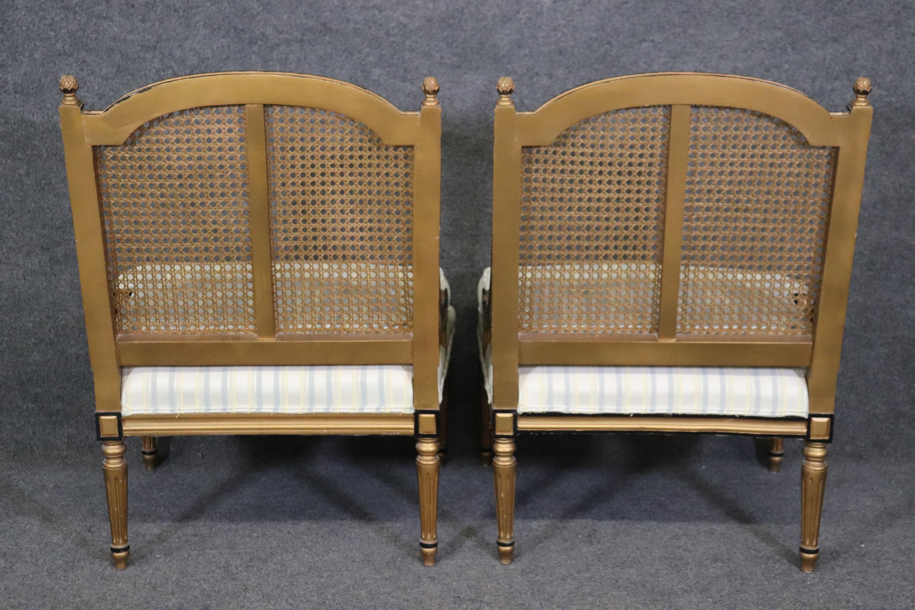 Caning Pair of French Louis XVI Style Black and Gold Cane Back Bergeres, Lounge Chairs For Sale