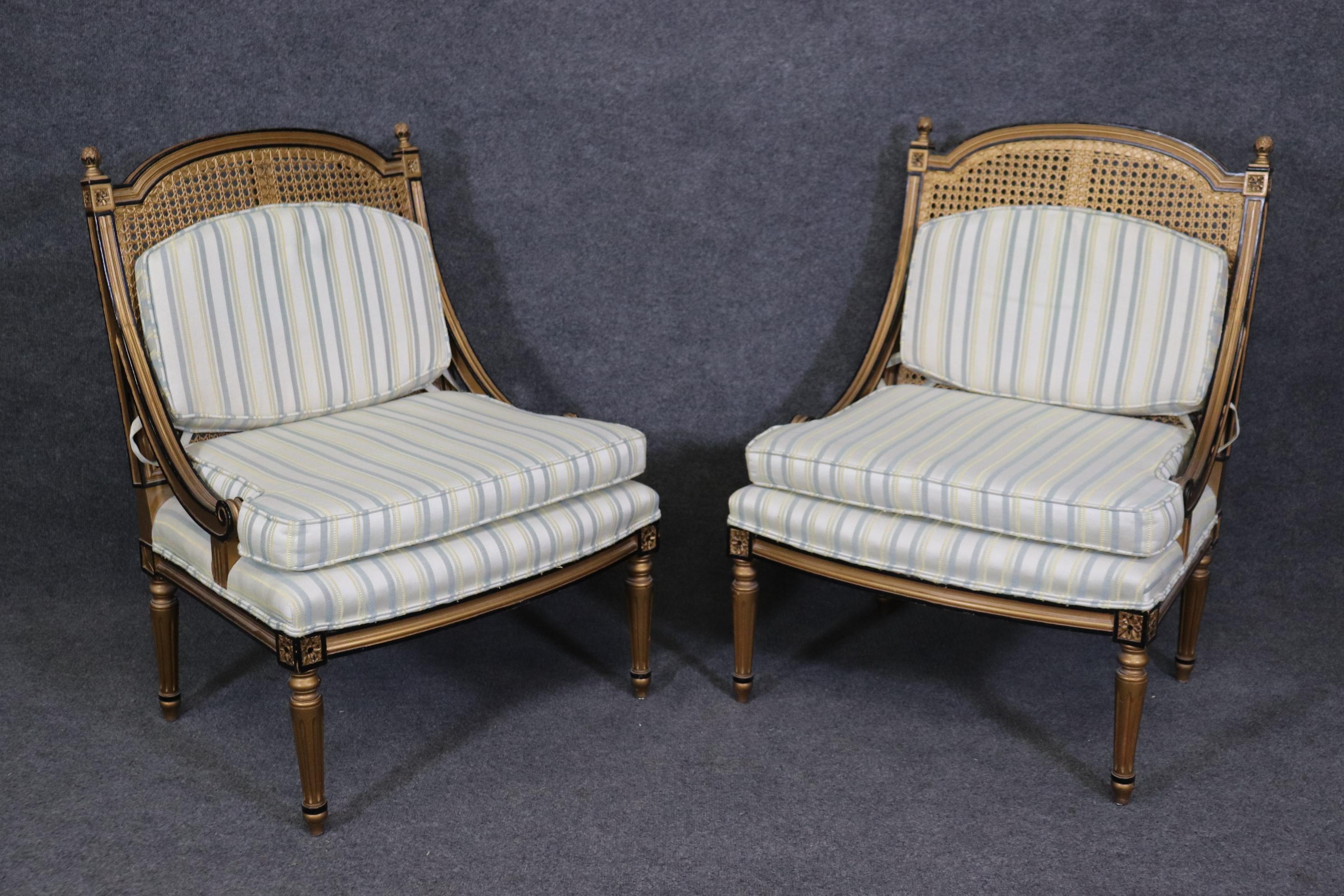 20th Century Pair of French Louis XVI Style Black and Gold Cane Back Bergeres, Lounge Chairs For Sale