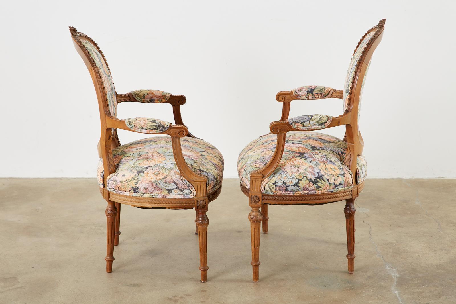 Hand-Carved Pair of French Louis XVI Style Carved Fauteuil Armchairs For Sale