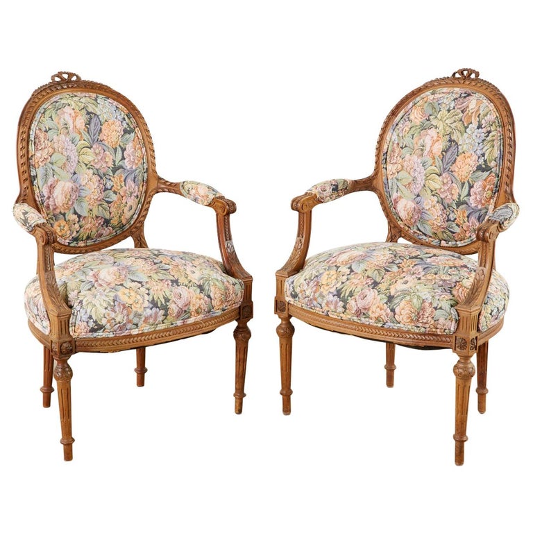 LOUIS XVI STYLE CARVED AND PAINTED RIBBON ARM CHAIR