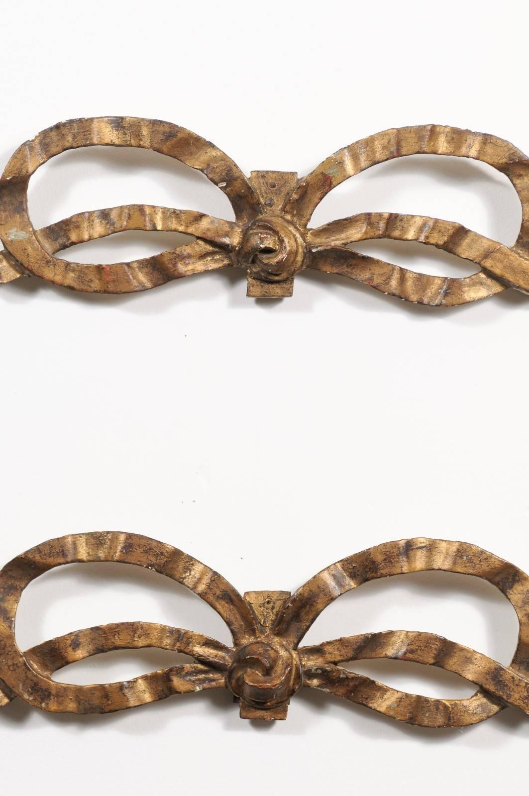 20th Century Pair of French Louis XVI Style Carved Giltwood Ribbon Decorations, circa 1900