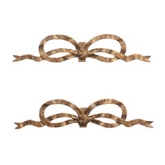 Pair of French Louis XVI Style Carved Giltwood Ribbon Decorations, circa 1900