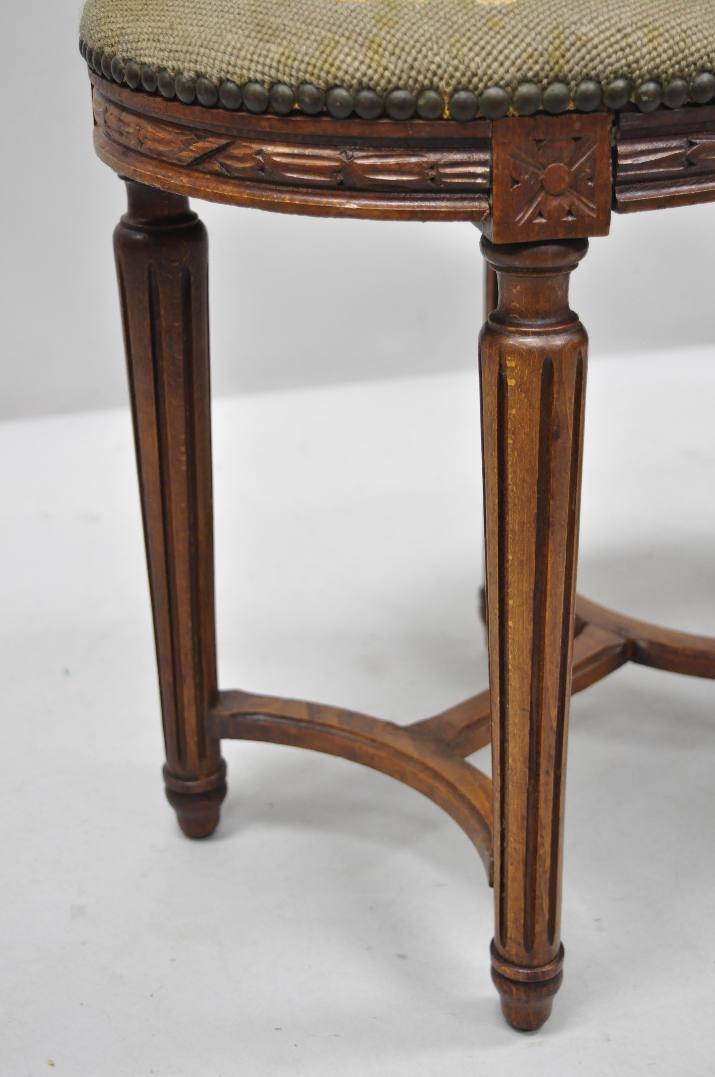 20th Century Pair of French Louis XVI Style Carved Walnut and Needlepoint Oval Stools