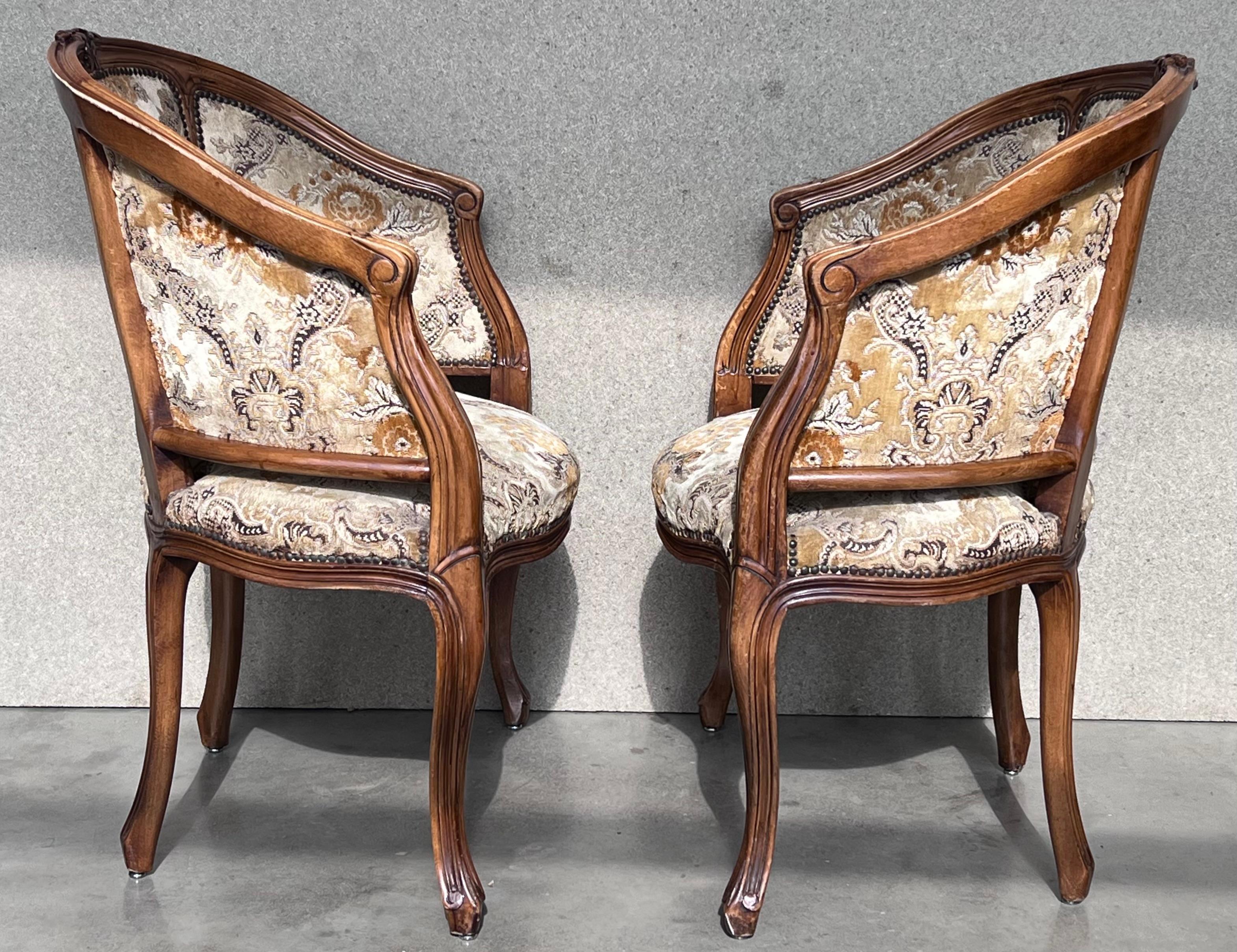 20th Century Pair of French Louis XVI Style Carved Walnut Round Bergere Armchairs