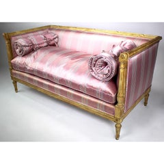 Coppia di divani francesi in stile Luigi XVI in legno intagliato e laccato color crema, Jansen Attr.