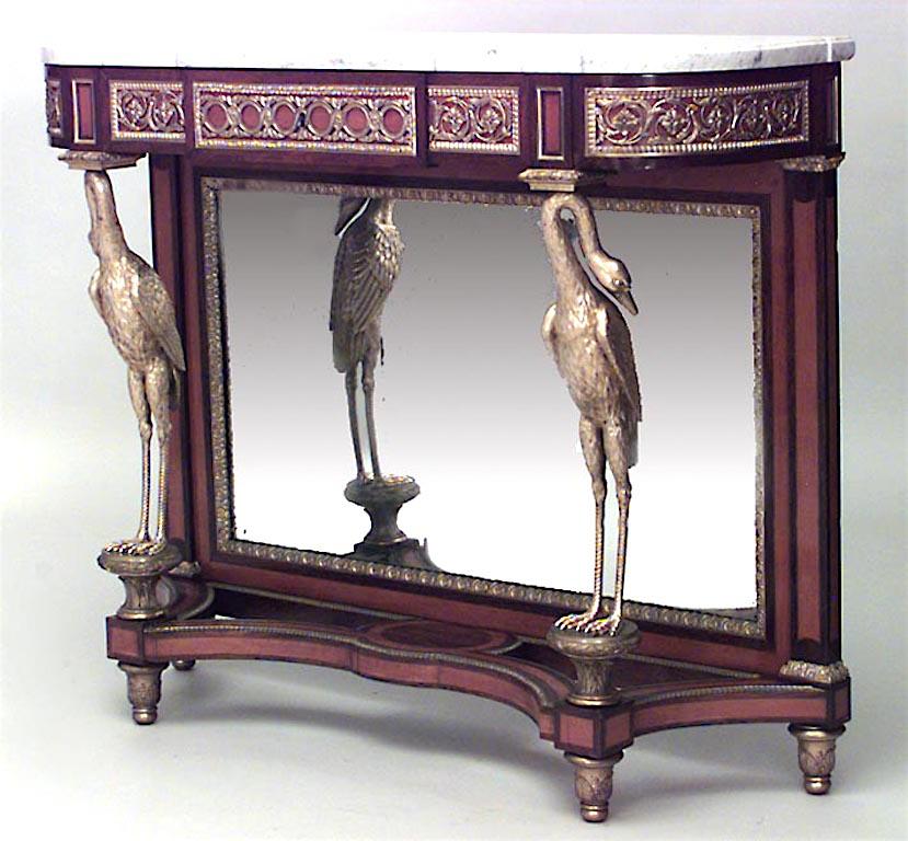 Pair of French Louis XVI style ‘19th century’ mahogany and satinwood console tables with bronze doré heron supports and mirrored back panel with white marble tops. Signed SAUNIER.
   