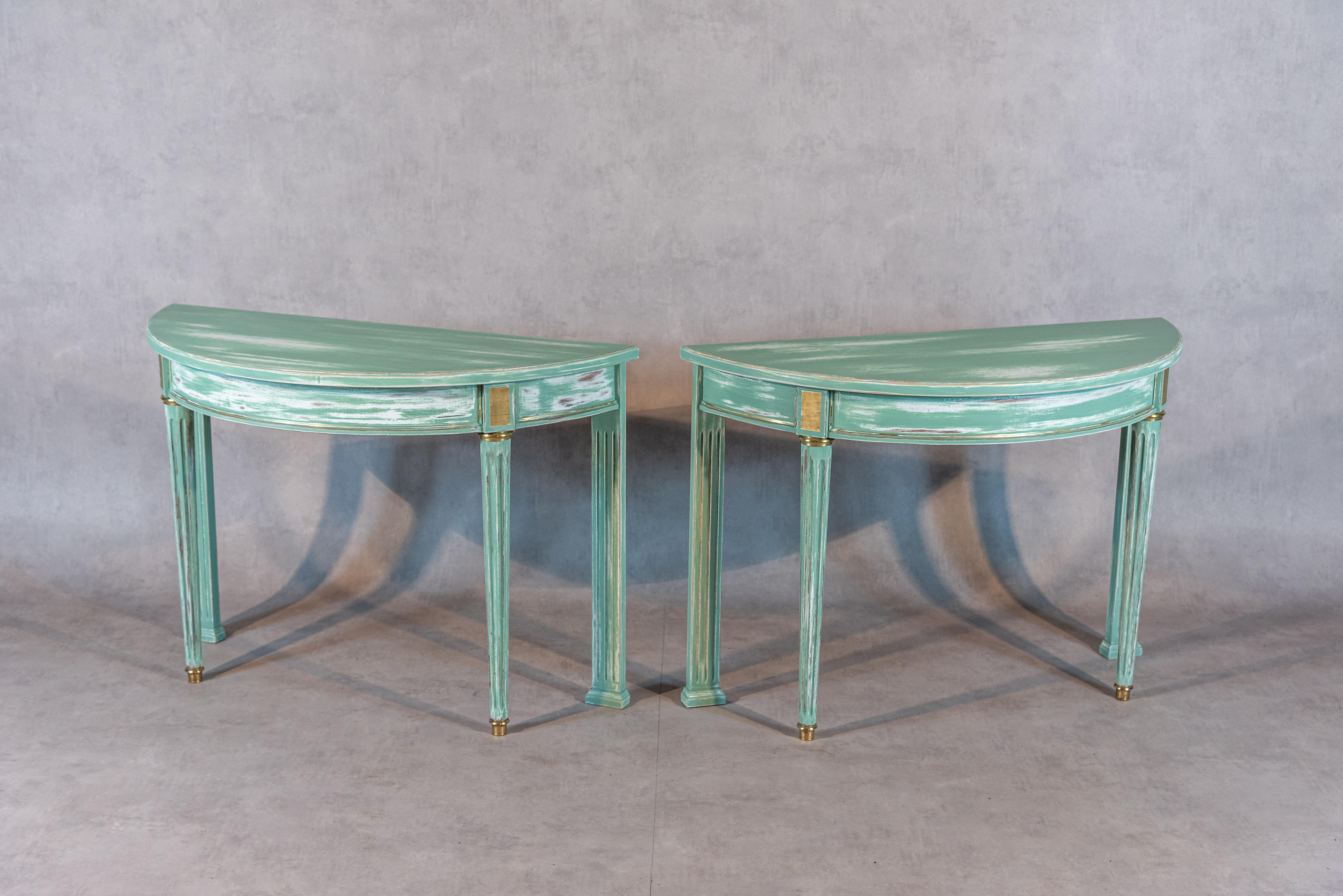 This pair of Louis XVI-style demilune consoles is a stunning and unique addition to any interior space. Created at our atelier in France, these consoles are part of our rethought antique lineup. We took a 20th-century Louis XVI-style round dining