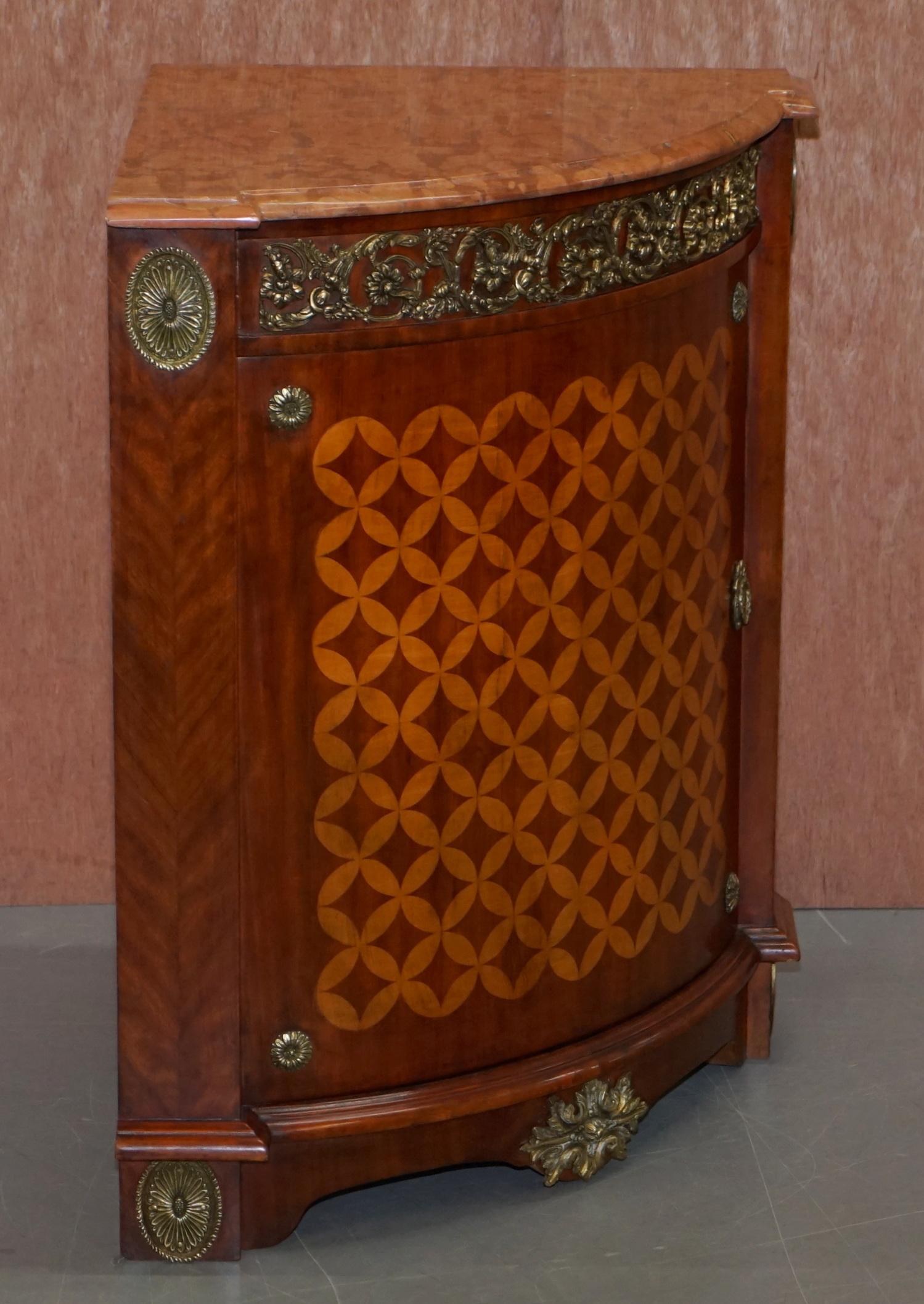 We are delighted to offer for sale this lovely pair of Louis XVI style mahogany and walnut marquetry inlaid corner cabinets with gilt metal fittings and solid marble top

A very good looking, decorative and well made pair, they are circa 1900 but
