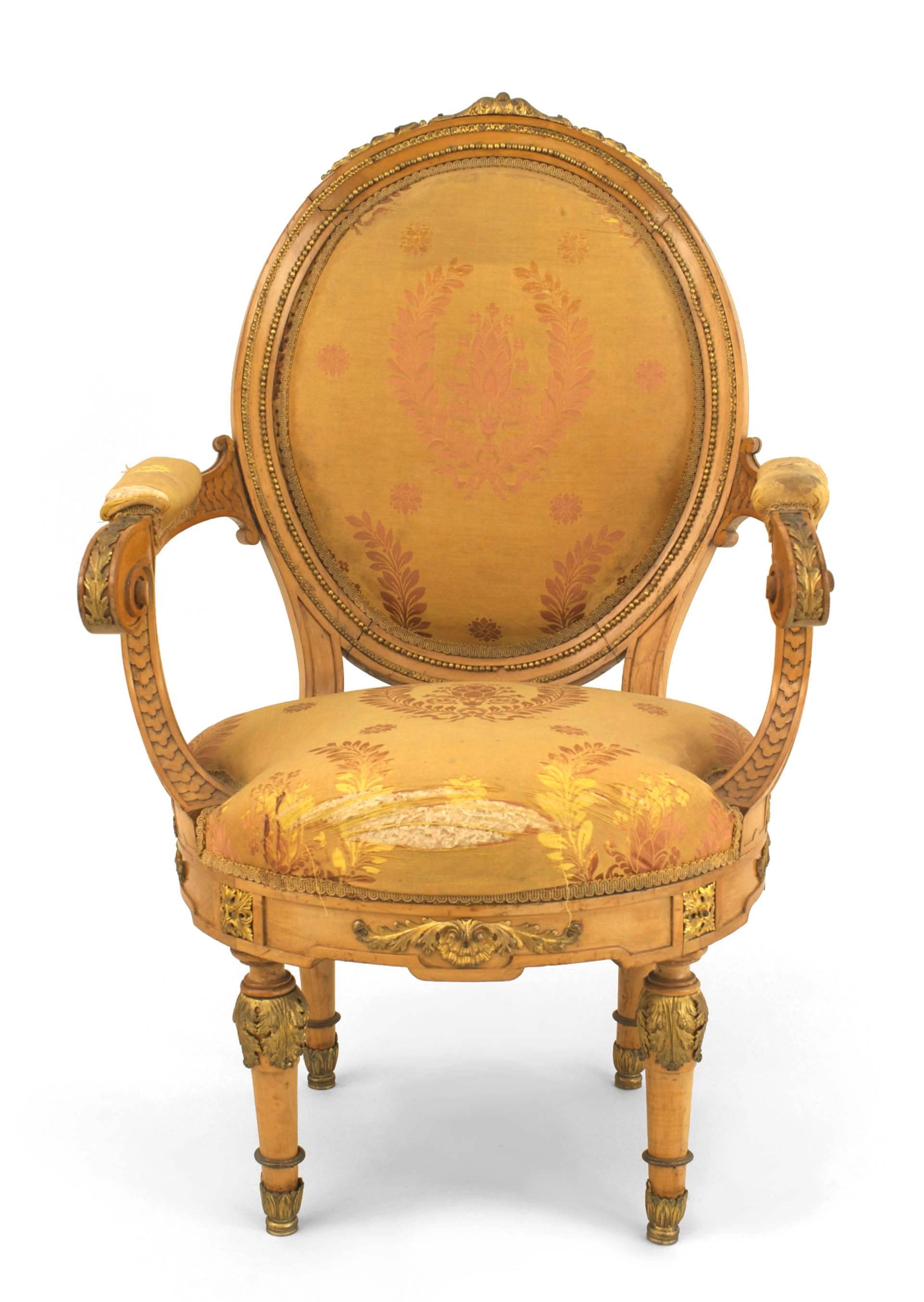 Pair of French Louis XVI style gilt metal mounted sycamore fauteuils (open Armchairs) with oval yellow silk damask upholstered back & seat (early 20th Cent)
