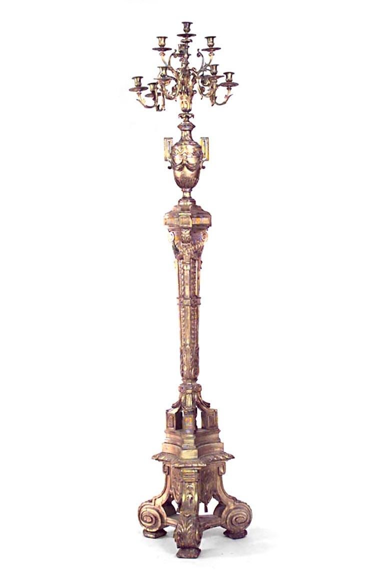 Pair of French Louis XVI-style (19th Century) gilt wood floor torchiere with urn design and 9 bronze arms (PRICED AS Pair).
