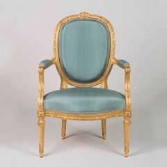 Pair of French Louis XVI Style Giltwood Armchairs by François Linke