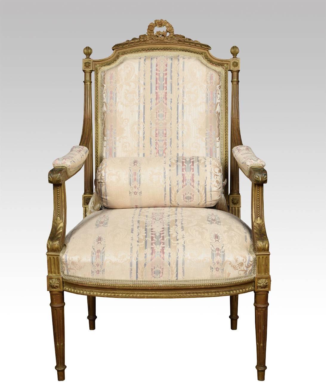 Pair of French Louis XVI style giltwood armchairs the carved cresting top rail above upholstered padded backs, seats and arms raised up on turned fluted legs

Dimensions:

Height 42.5 inches, height to seat 16 inches

Width 25 inches

Depth