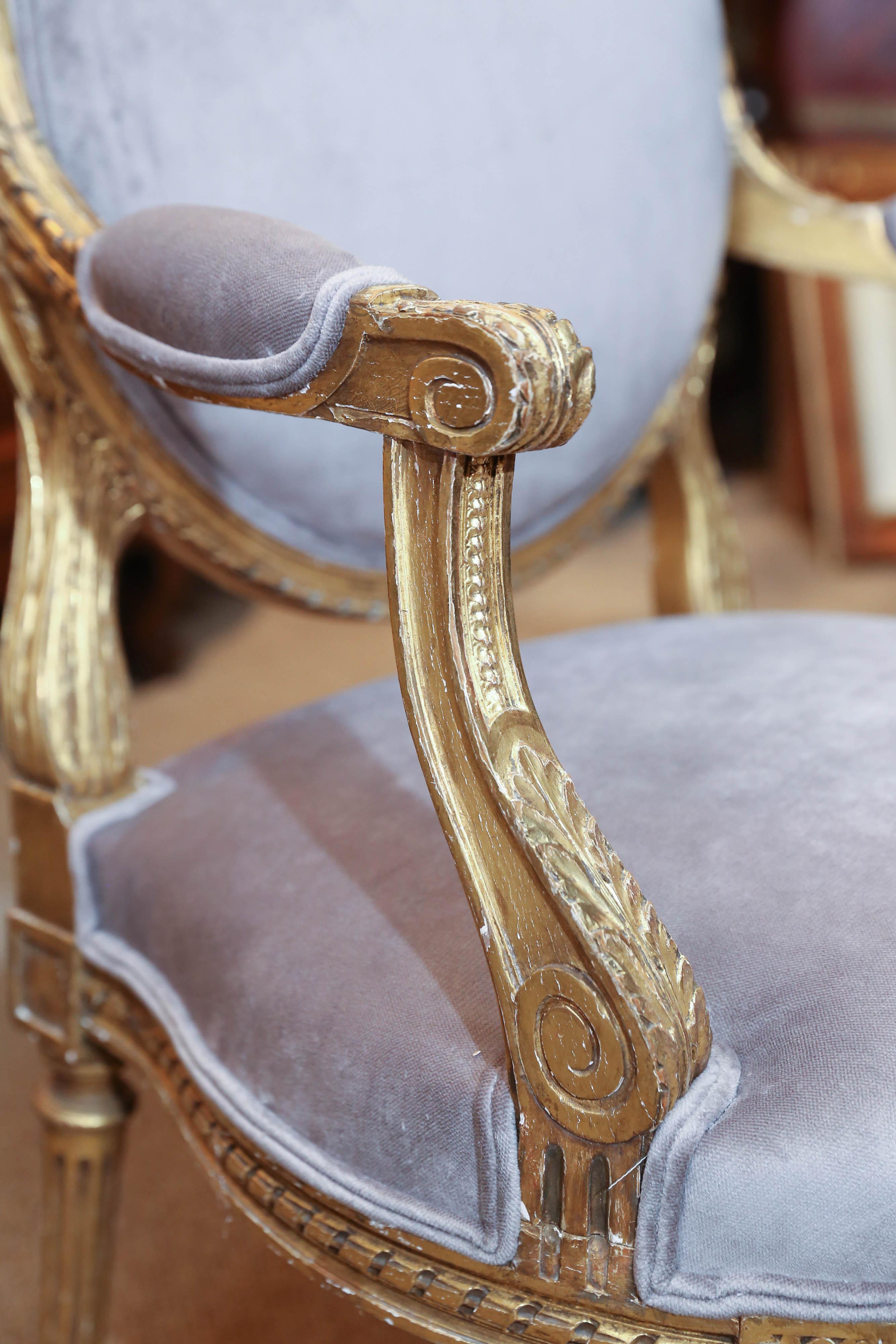 European Pair of French Louis XVI Style Giltwood Fauteuils, Early 19th Century