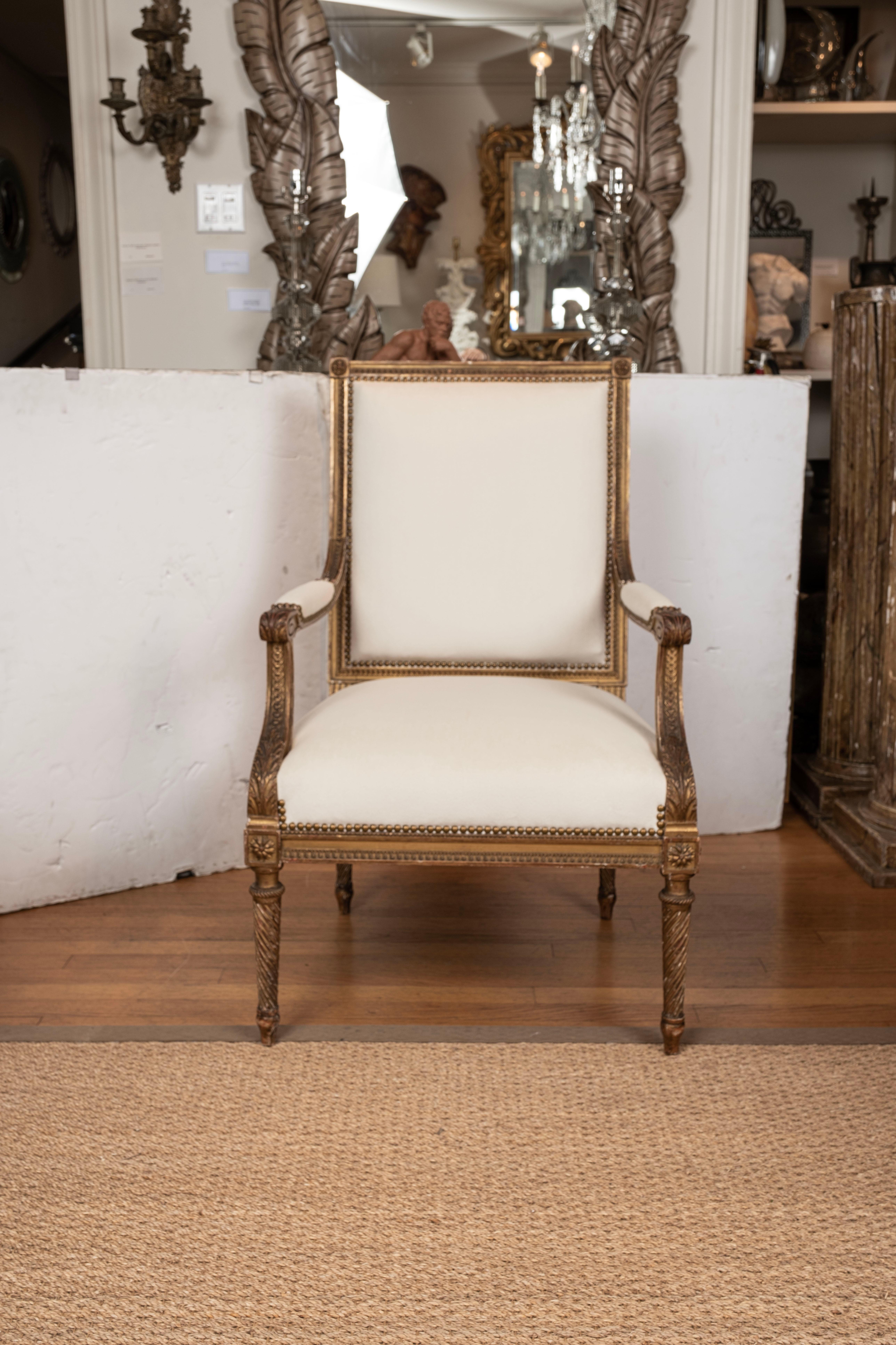 Pair of French Louis XVI style giltwood fauteuils or armchairs.
This lovely pair of French Louis XVI style gilt wood fauteuils, armchairs or side chairs are generous in size and are newly upholstered in cream low pile mohair like fabric.
Excellent