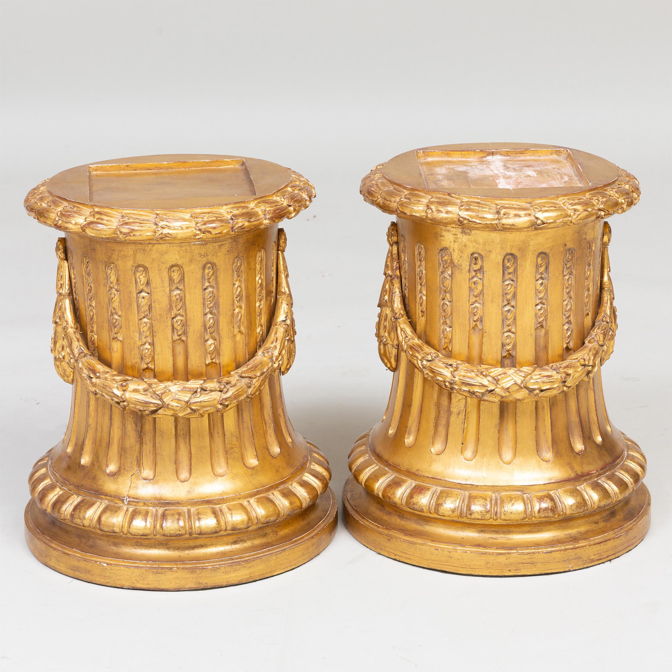 Fluted pedestals with garlands draped around the shafts and capitals. 

Date: 19th century
Origin: French
Dimension: 17 in. hight
