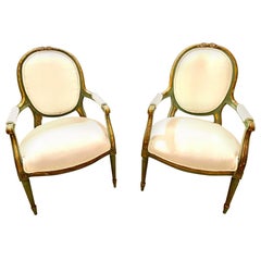 Pair of French Louis XVI Style Green Paint and Gilt Chairs with Bow Decoration