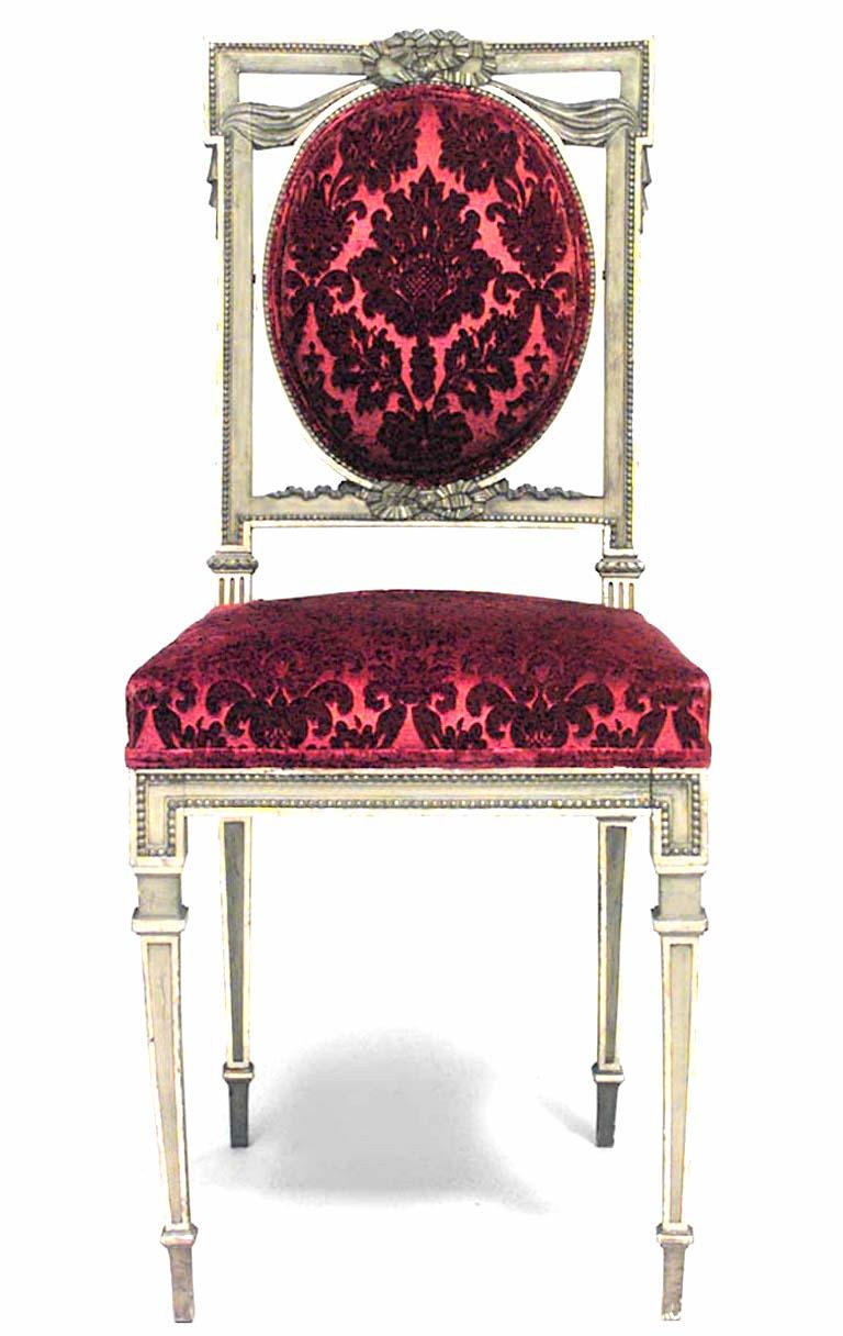 Pair of French Louis XVI style ‘late 19th century’ gilt square back side chairs with red cut velvet upholstery.

   