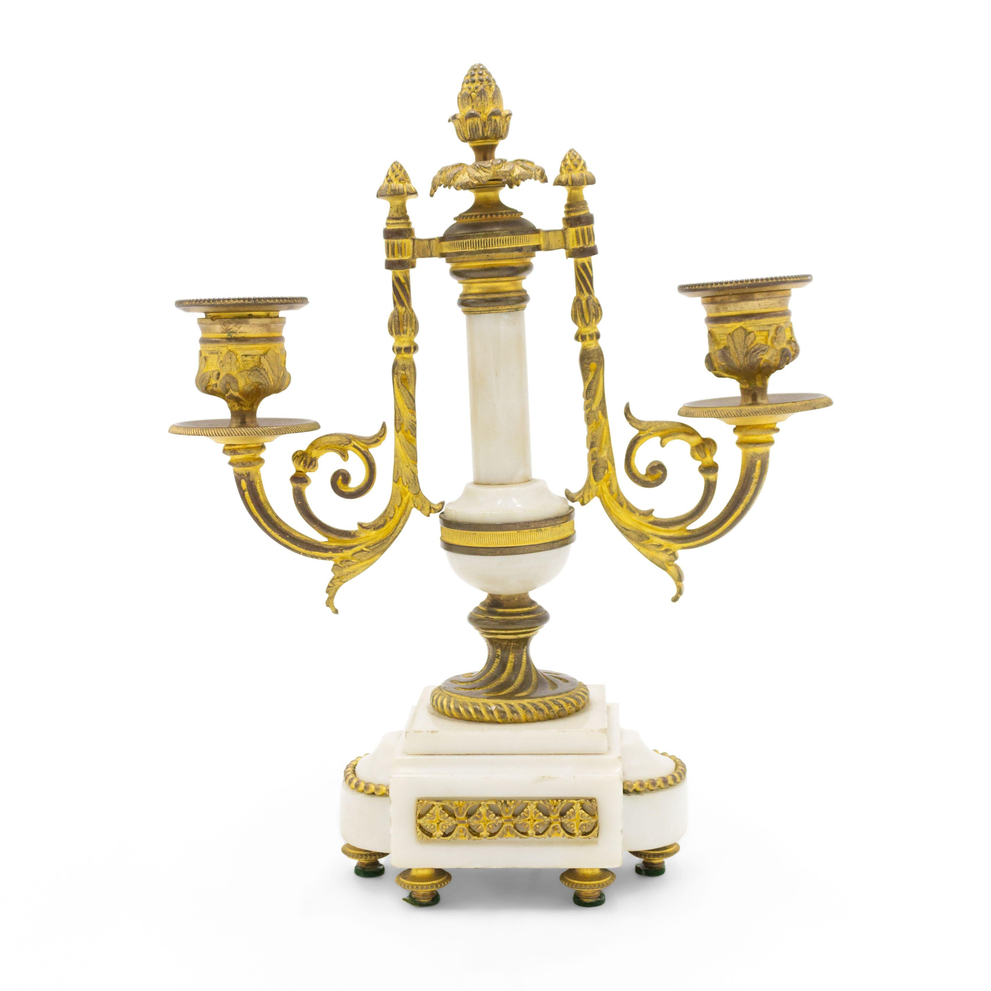 Pair of French Louis XVI-style (19th Century) white marble and bronze 2 arm candelabras (PRICED AS PAIR).
 