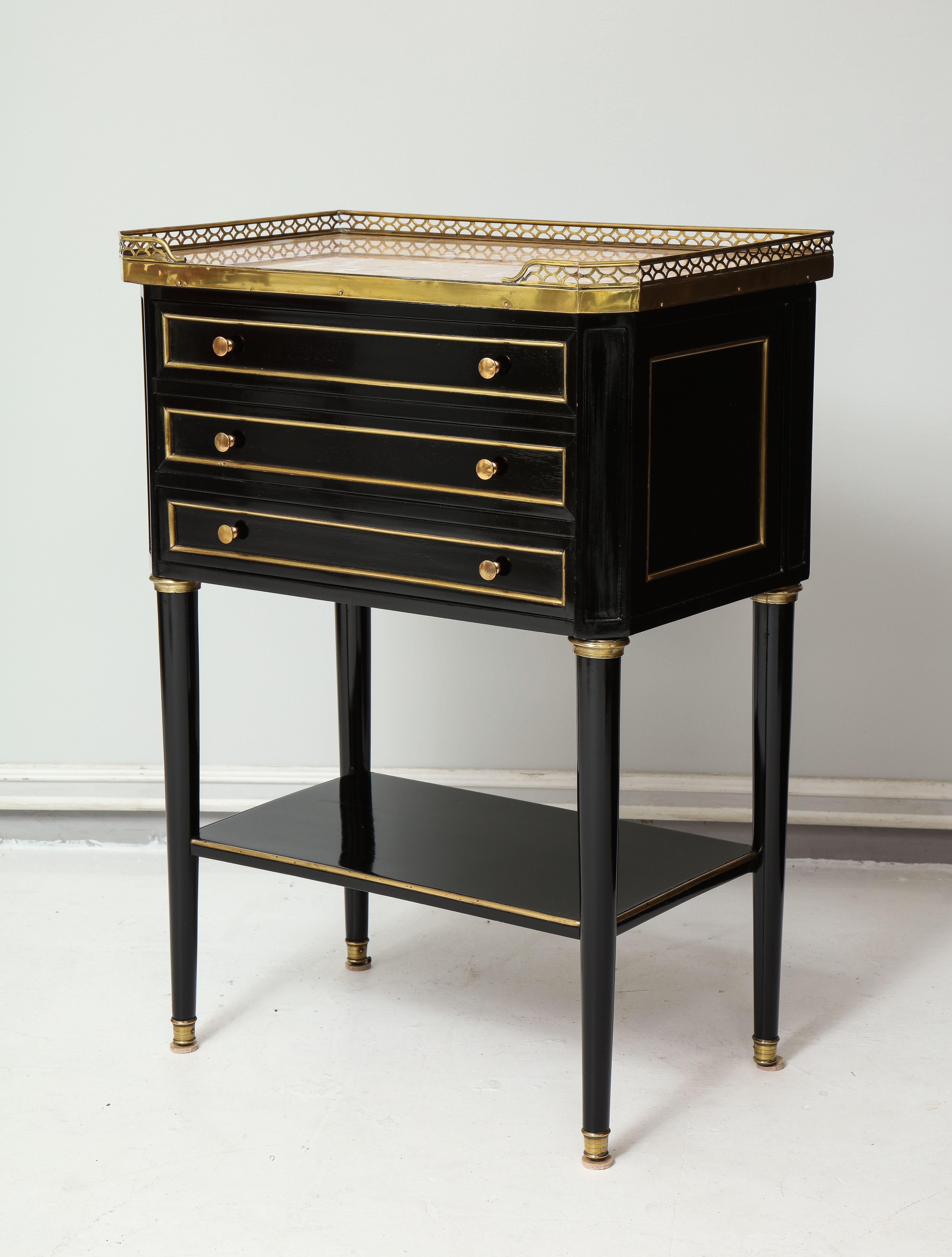 Pair of French Louis XVI style marble-top end tables/ nightstands with brass gallery.