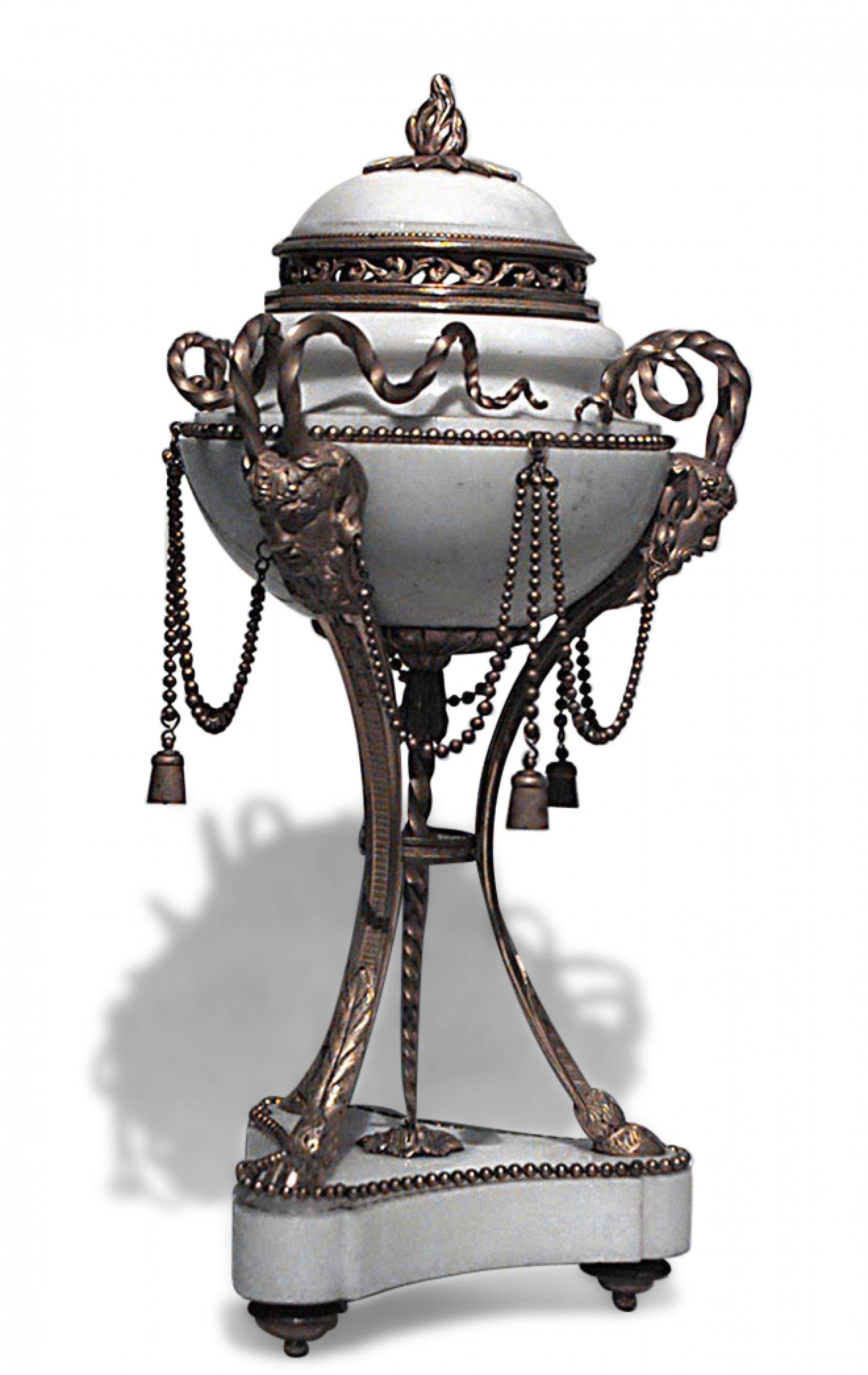 PAIR of French Louis XVI style bronze ormolu mounted white marble cassolettes with tassel chain hung around an ovoid body with 3 satyr headed legs (late 19th Cent) (PRICED AS PAIR)

Missing 1 tassel strand
