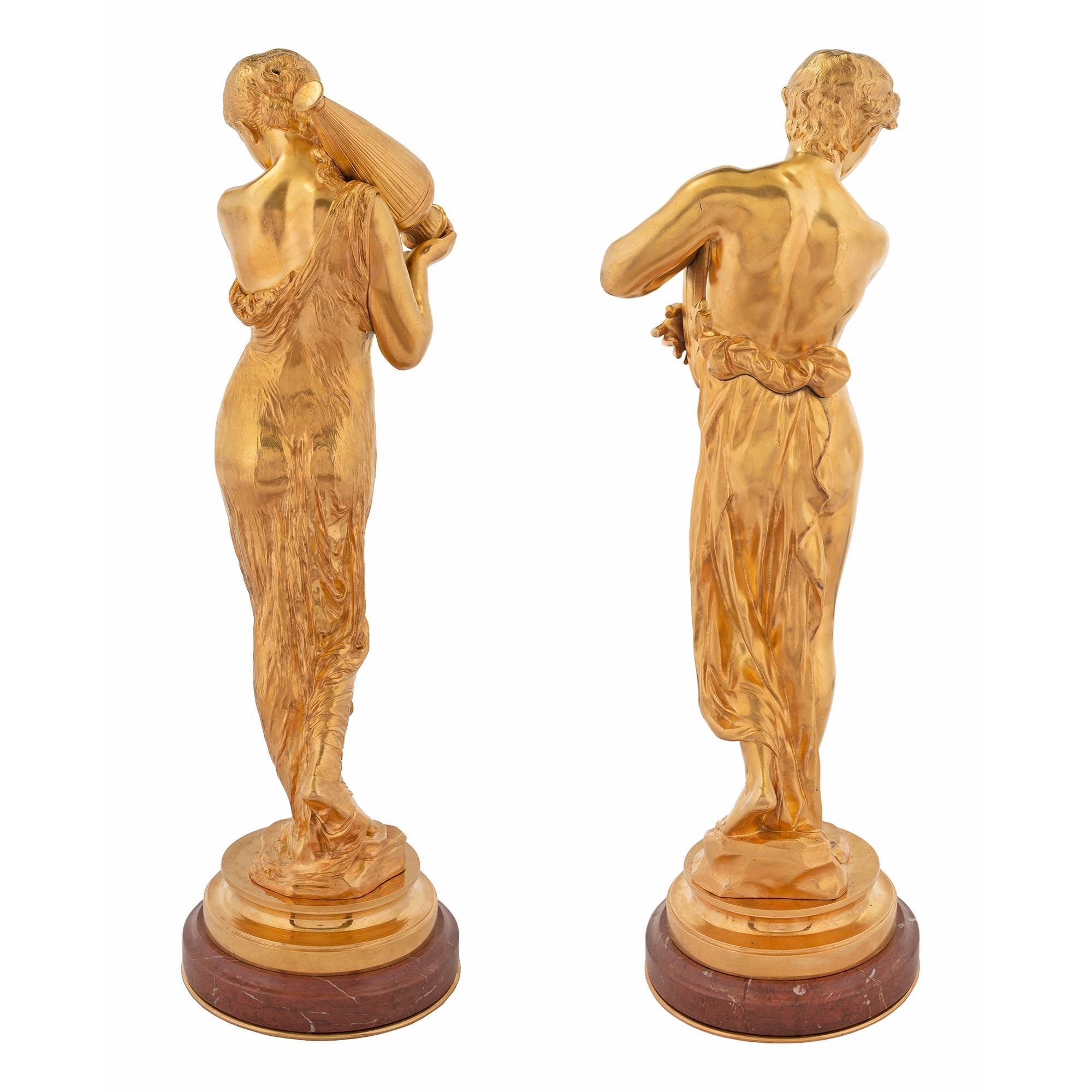 19th Century Pair of French Louis XVI Style Ormolu and Rouge Griotte Marble Statues For Sale