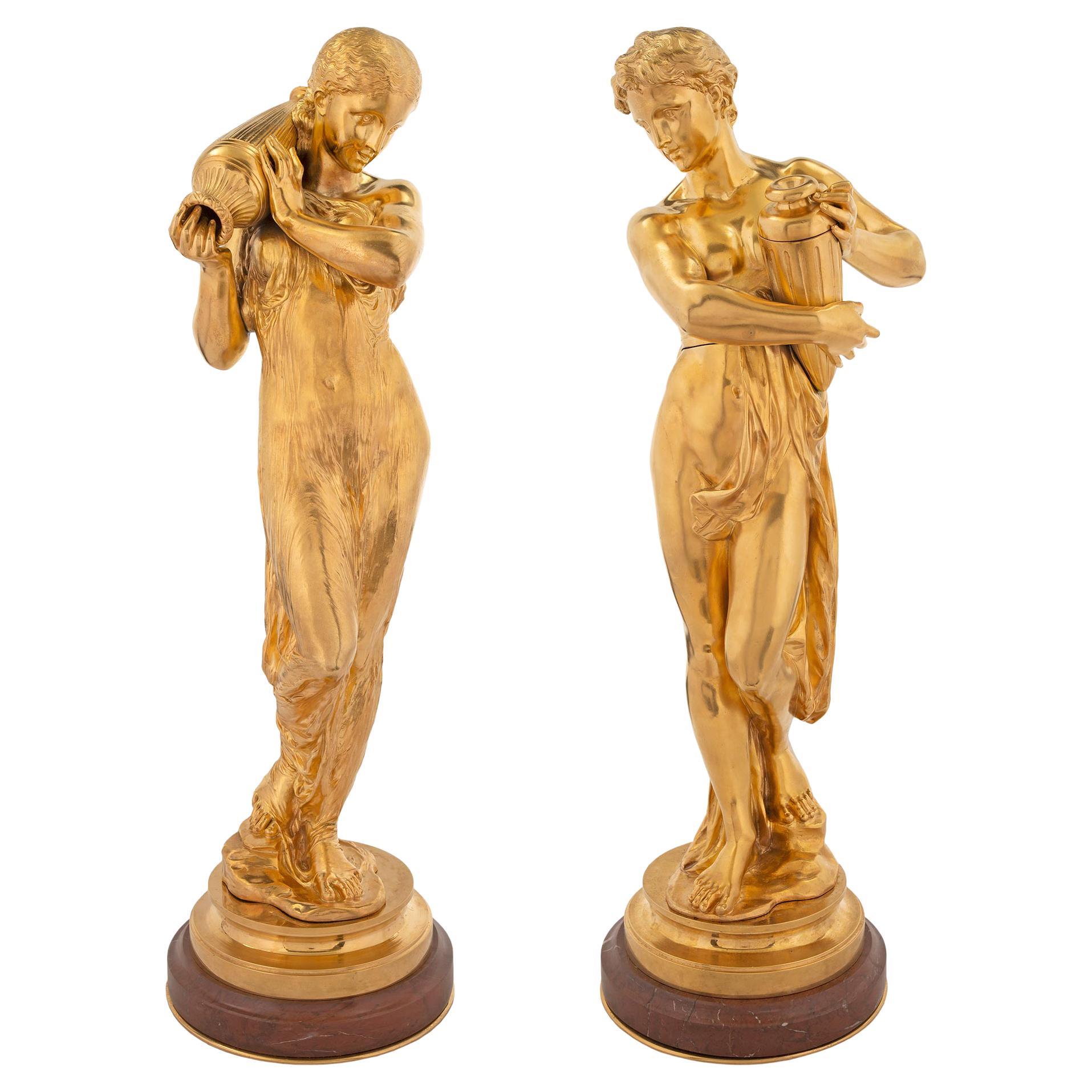 Pair of French Louis XVI Style Ormolu and Rouge Griotte Marble Statues For Sale