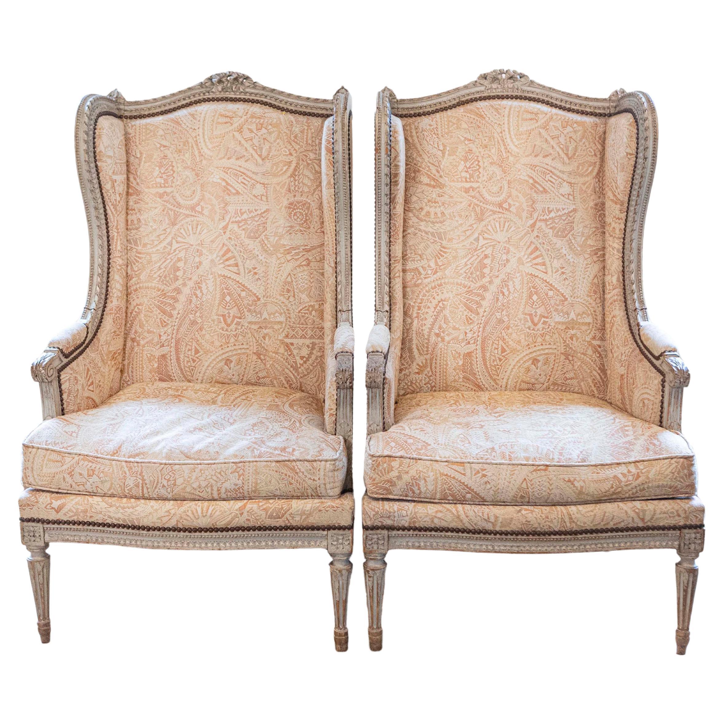 Pair of French Louis XVI Style Painted and Carved Wooden Bergères à Oreilles