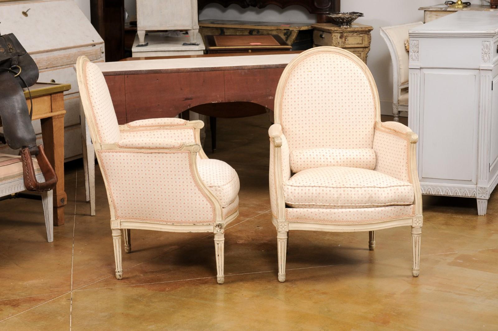 Upholstery Pair of French Louis XVI Style Painted Bergères Chairs with Oval Shaped Backs For Sale