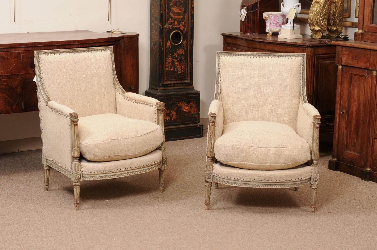 Pair of French Louis XVI Style Painted Bergeres with Linen Upholstery, Early 20th Century