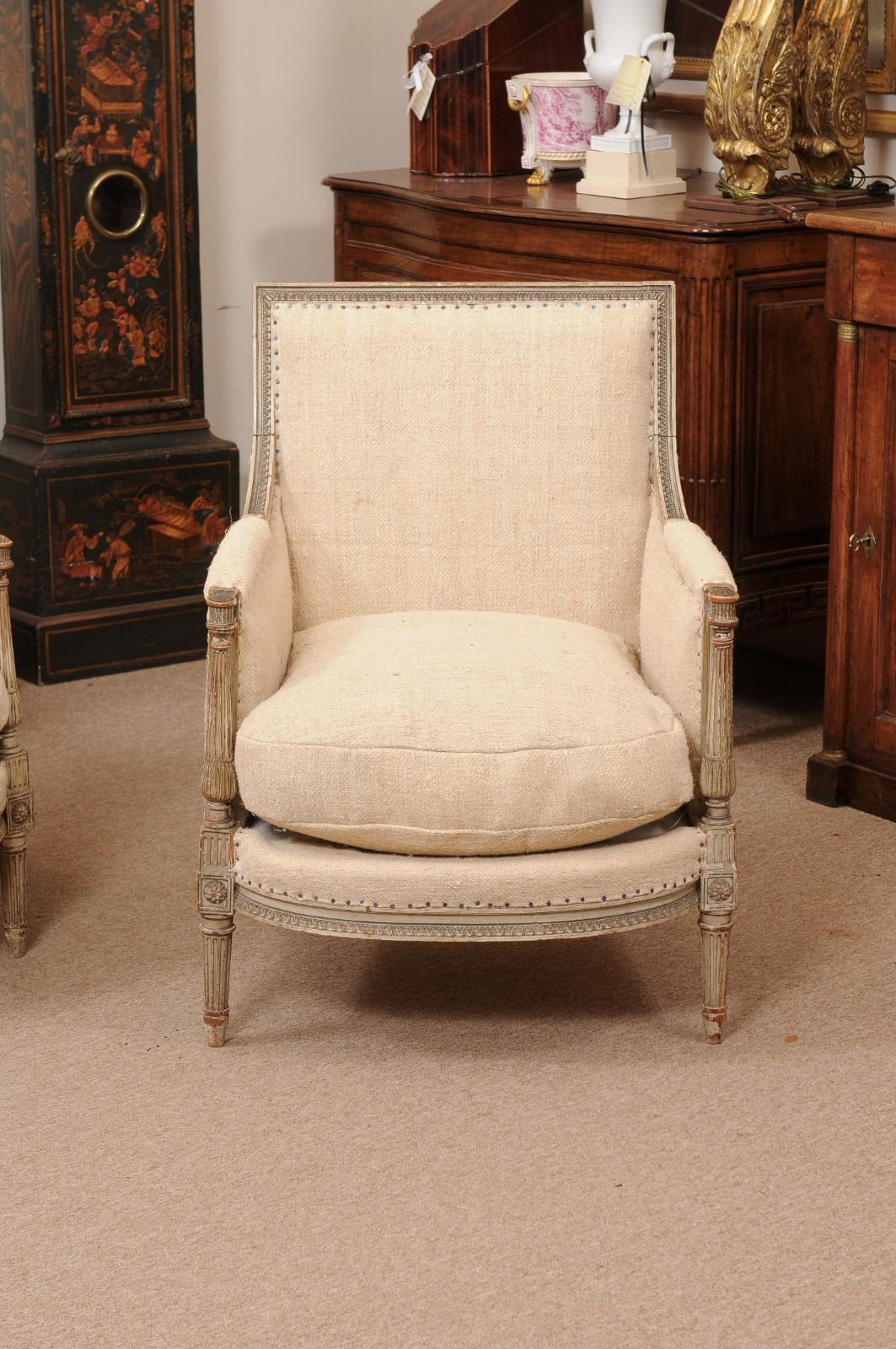 20th Century Pair of French Louis XVI Style Painted Bergeres with Linen Upholstery For Sale