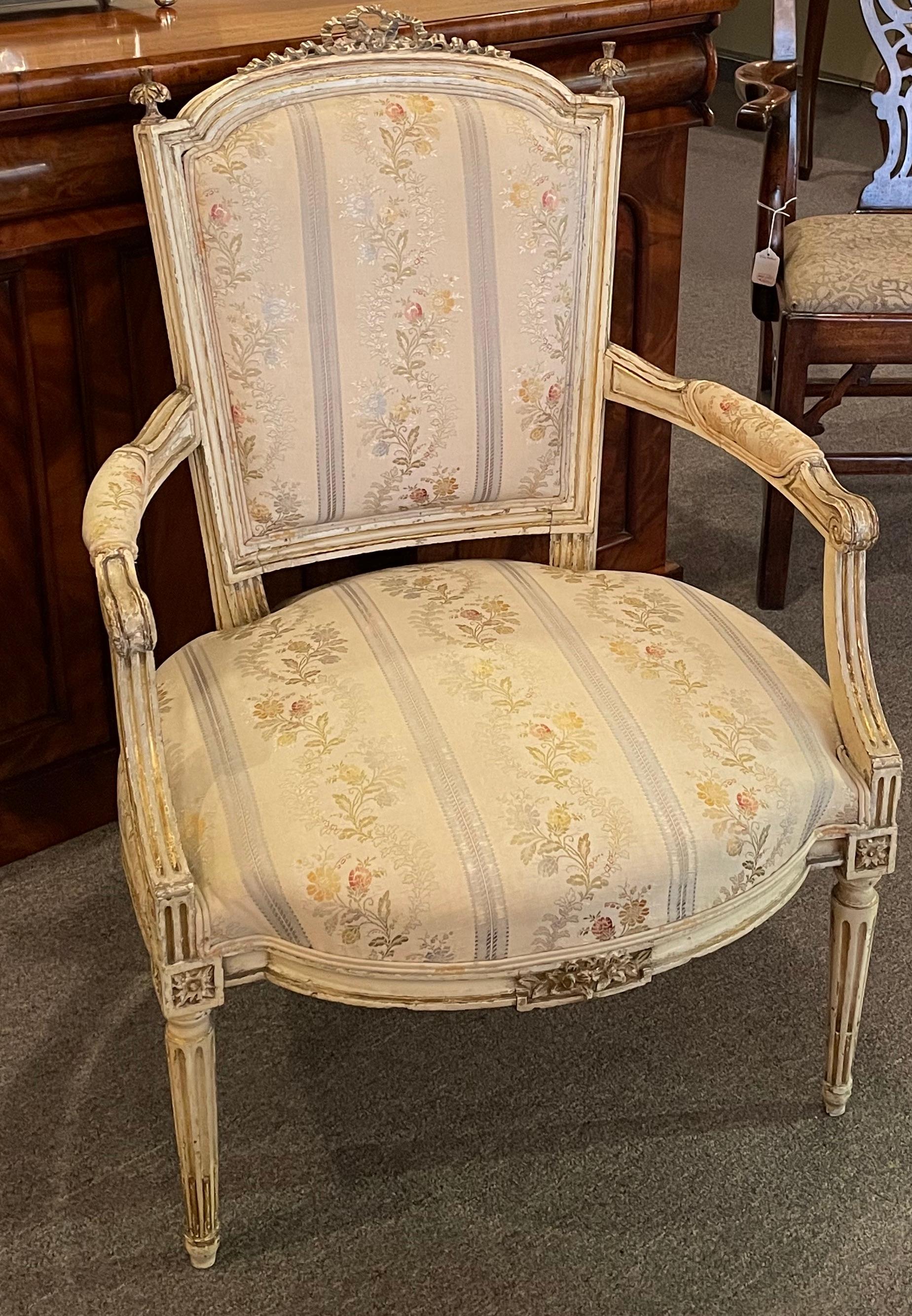 Pair of French Louis XVI style painted fauteuils.