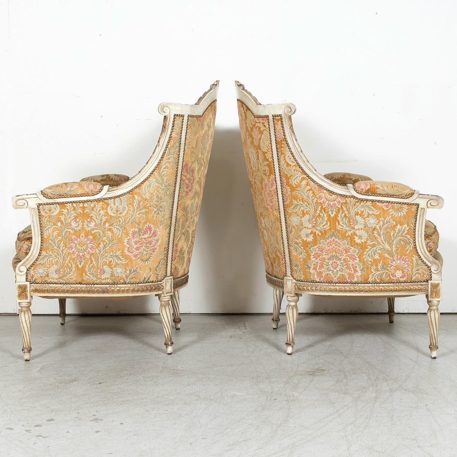 20th Century Pair of French Louis XVI Style Parcel Gilt and Painted Maison Jansen Bergeres  For Sale