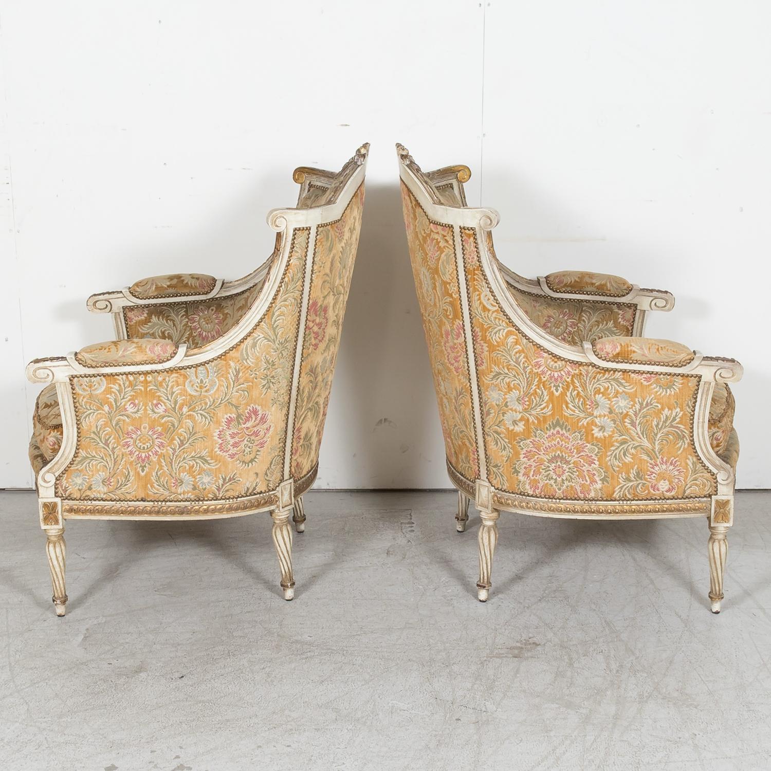 Wood Pair of French Louis XVI Style Parcel Gilt and Painted Maison Jansen Bergeres  For Sale
