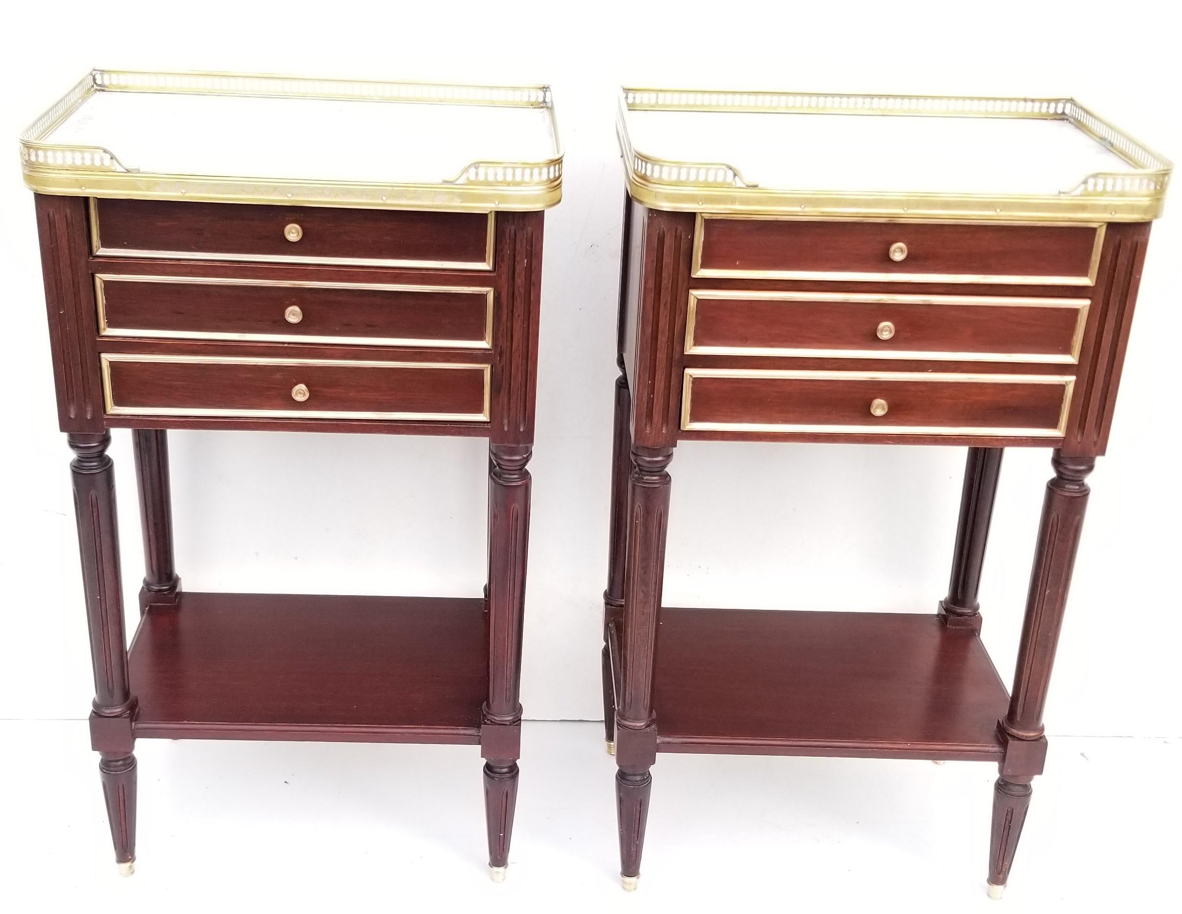 Pair of Louis XVI style side tables, 
Mahogany and Carrara marble top, brass gallery
3 drawers on the front, nice quality work from 1940s.
