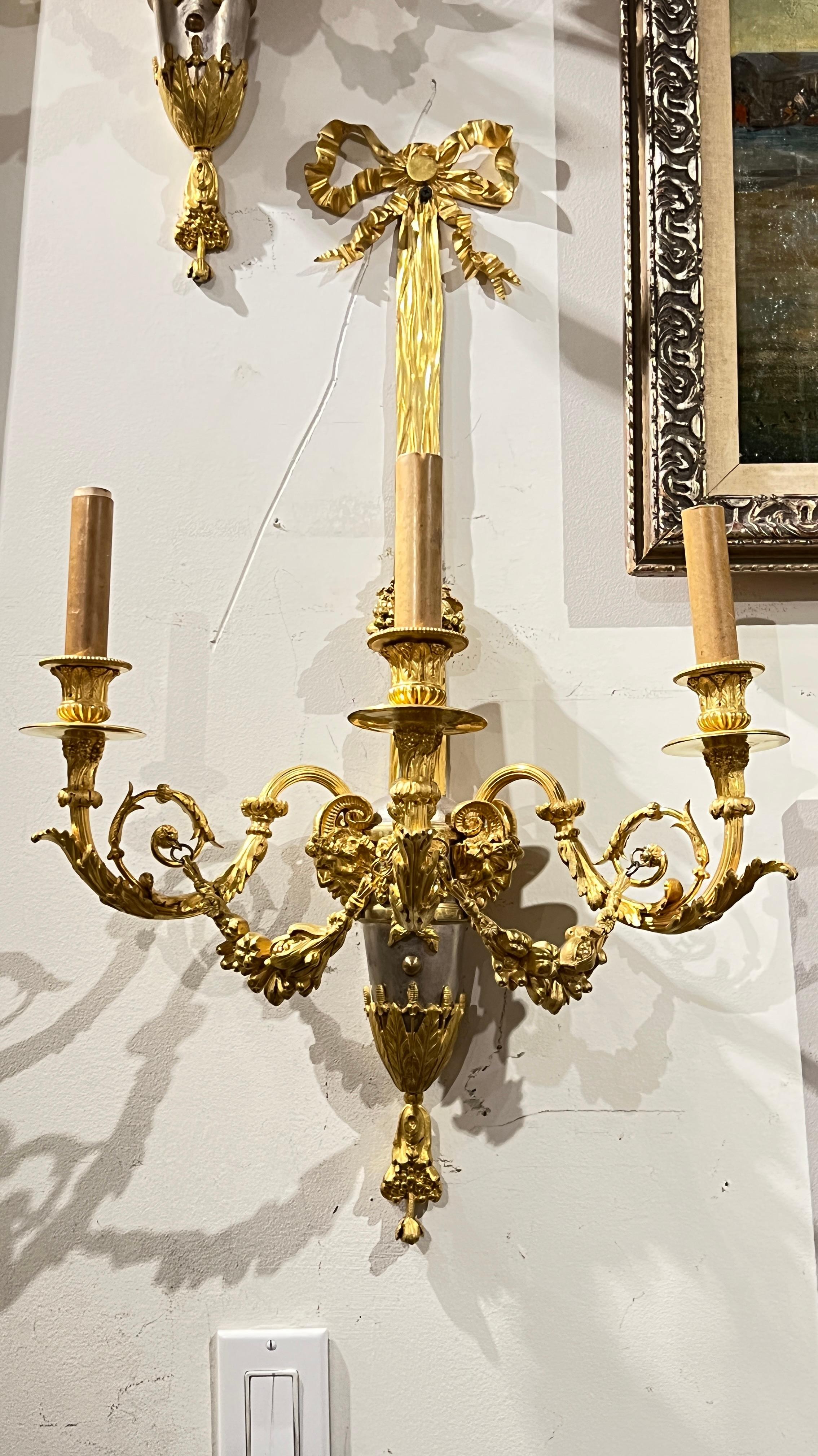 Pair of very fine quality French Louis XVI style silver and gilt bronze Sconces.