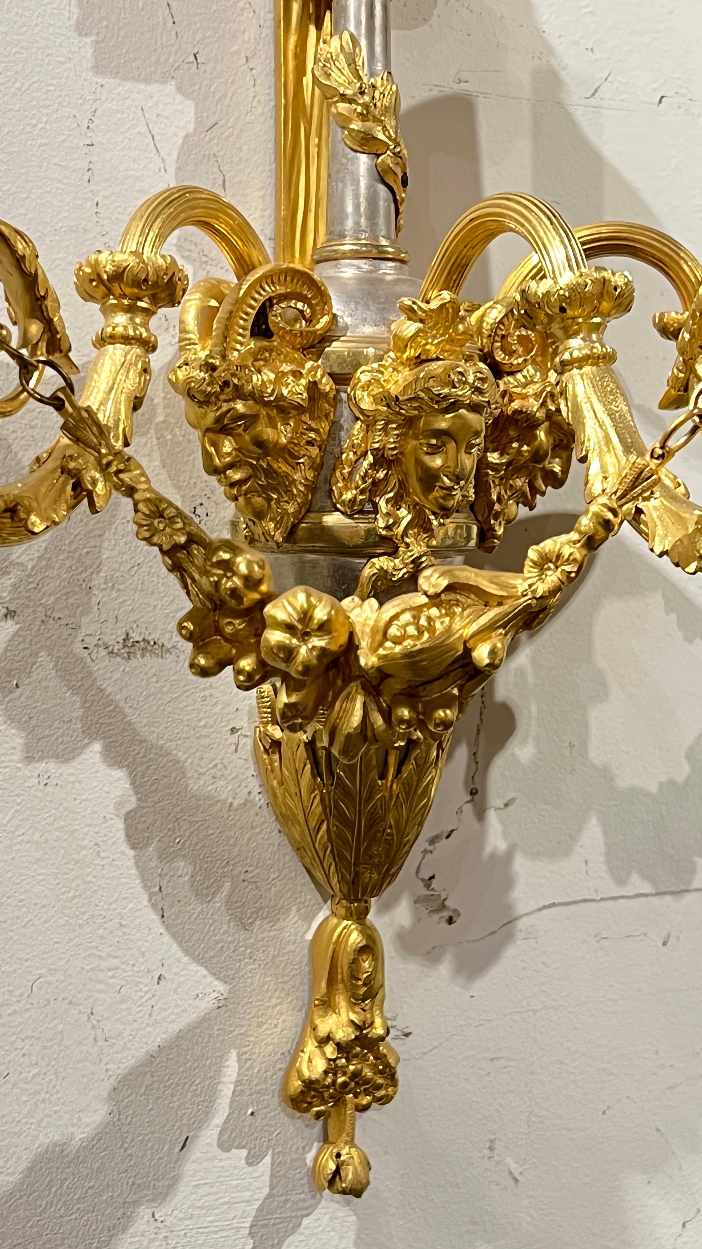 Early 20th Century Pair of French Louis XVI Style Silver and Gilt Bronze Sconces For Sale