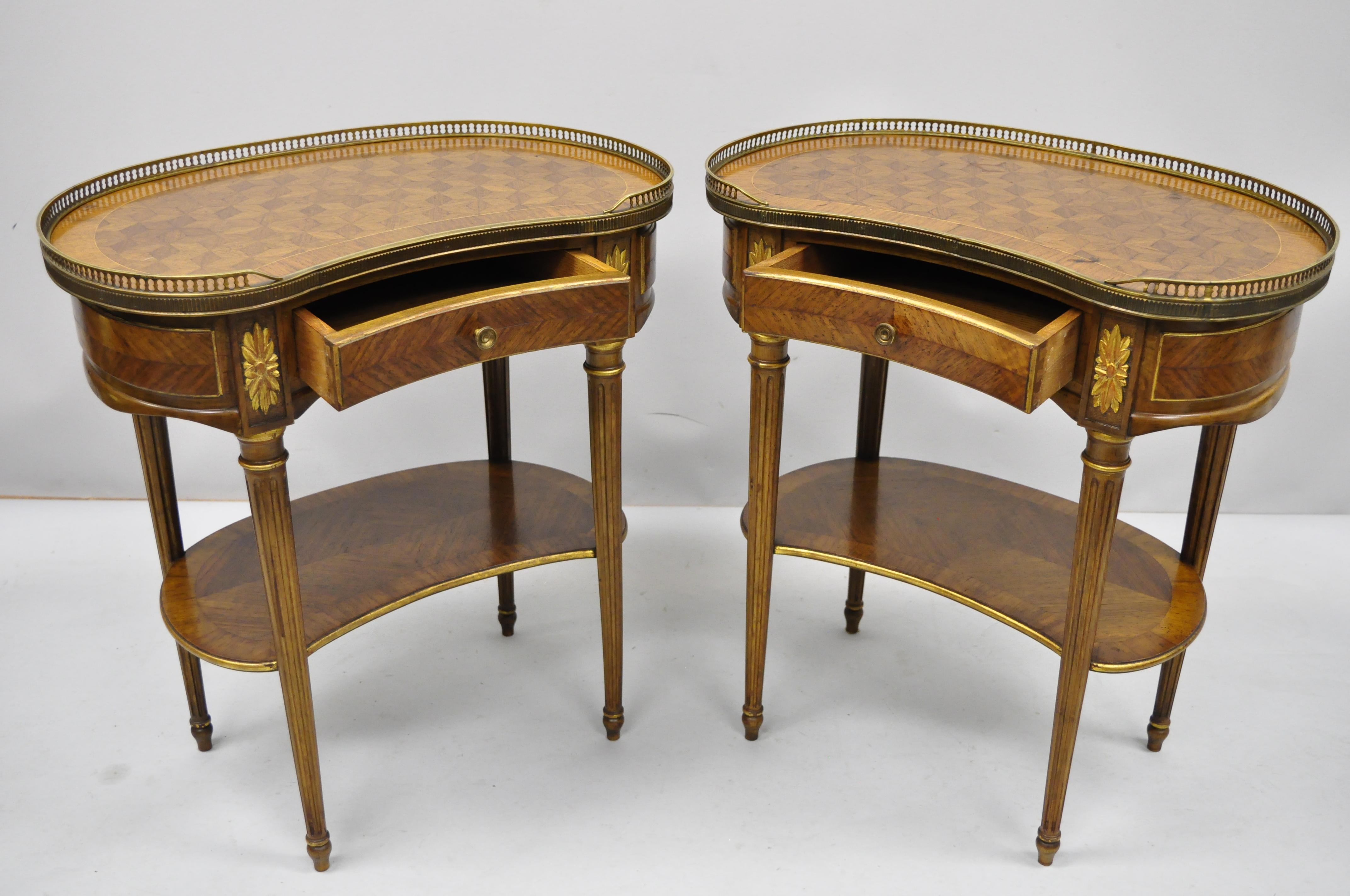 Pair of French Louis XVI style kidney shaped nightstand bedside tables by Simon Loscertales Bona. Item features one dovetailed drawer, brass gallery, marquetry inlay top, kidney bean shape, tapered legs, lower shelf, original tag, quality