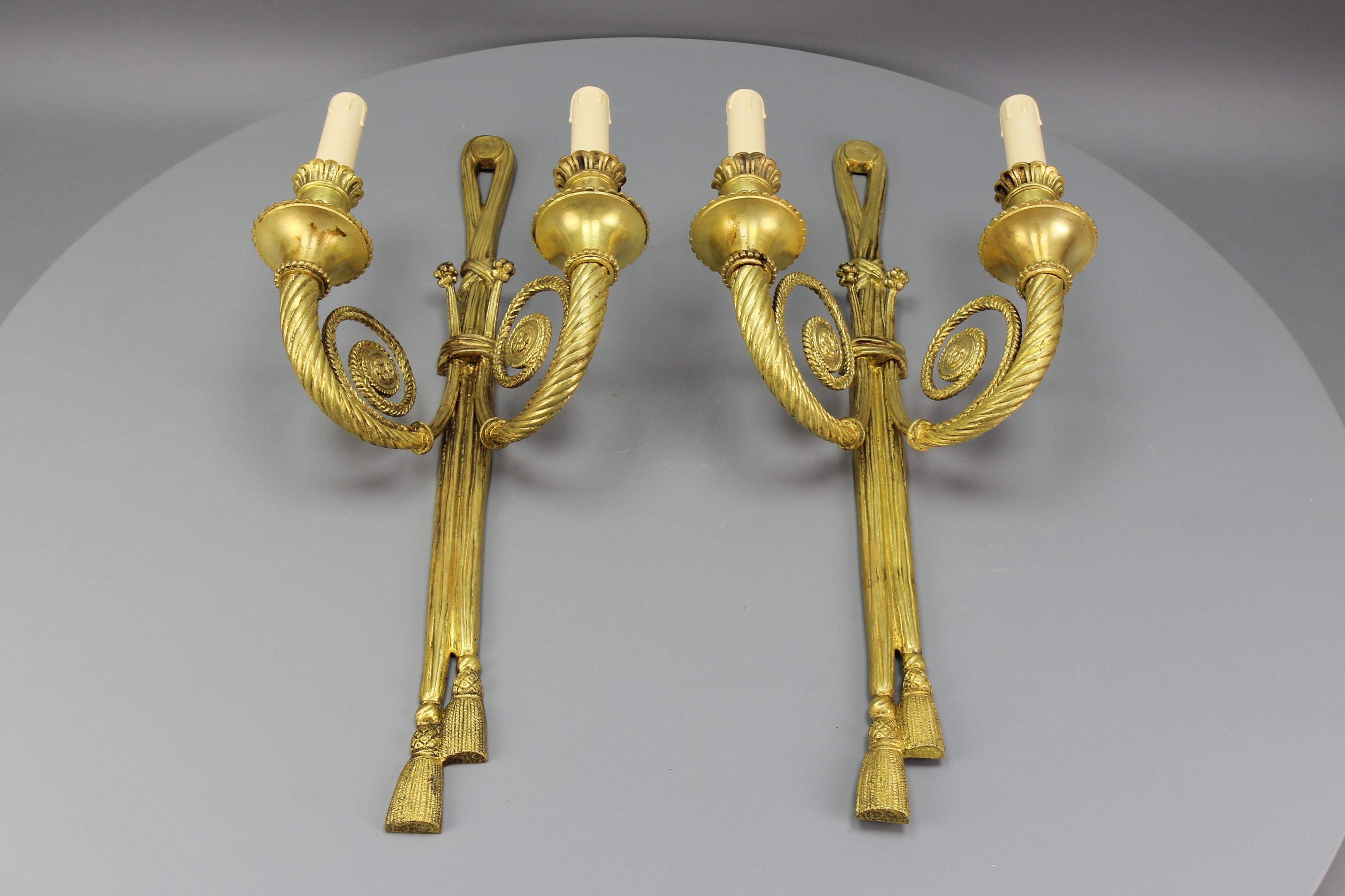 Bronze Pair of French Louis XVI Style Two-Arm Ribbon, Knot and Tassel Sconces, ca. 1910 For Sale