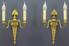 Pair of French Louis XVI Style Two-Light Gilt Bronze and Brass Sconces