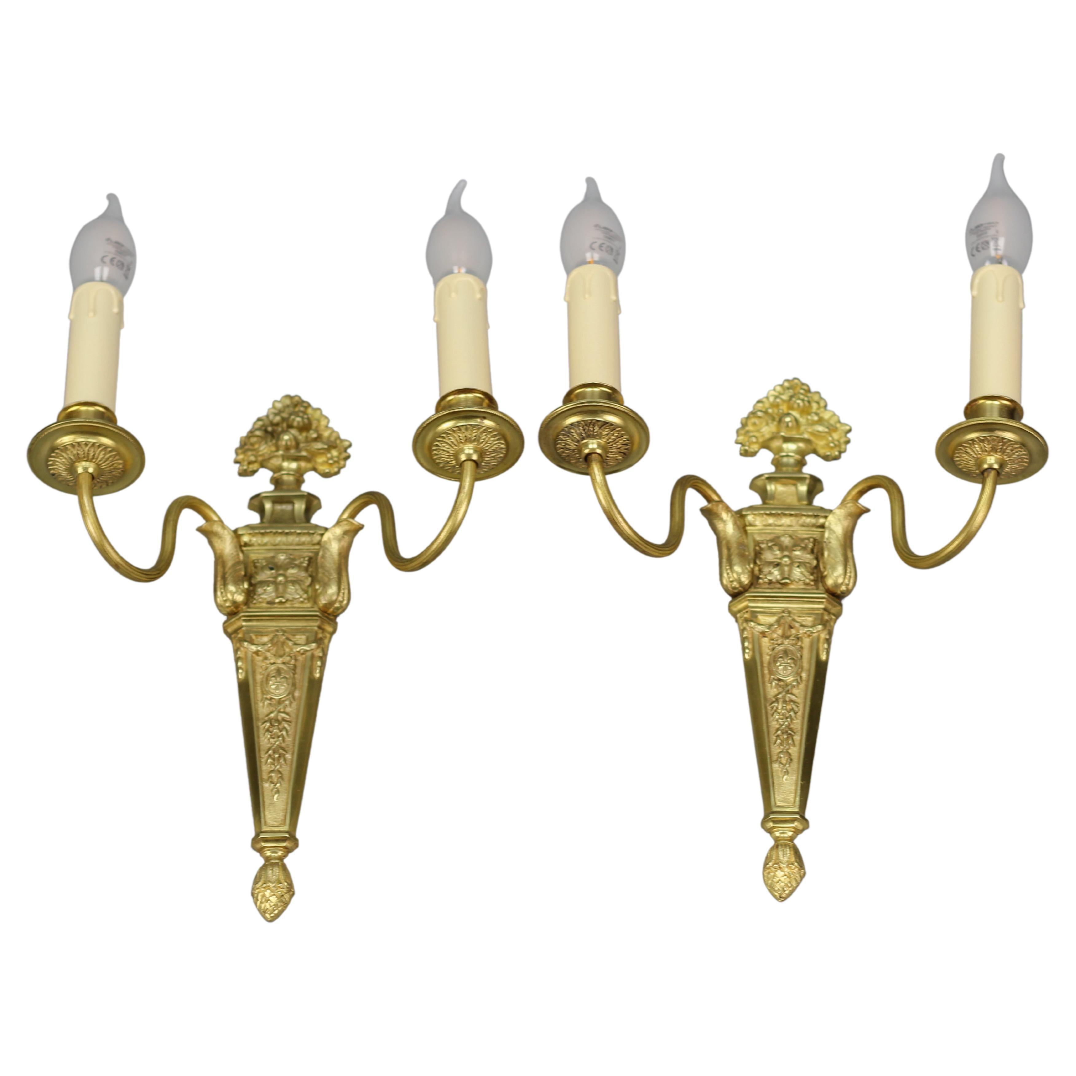 Pair of French Louis XVI Style Two-Light Gilt Bronze and Brass Sconces