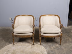 Pair of French Louis XVI Style Walnut Bergères with Ram Heads, 19th Century