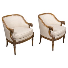 Pair of French Louis XVI Style Walnut Bergères with Ram Heads, 19th Century