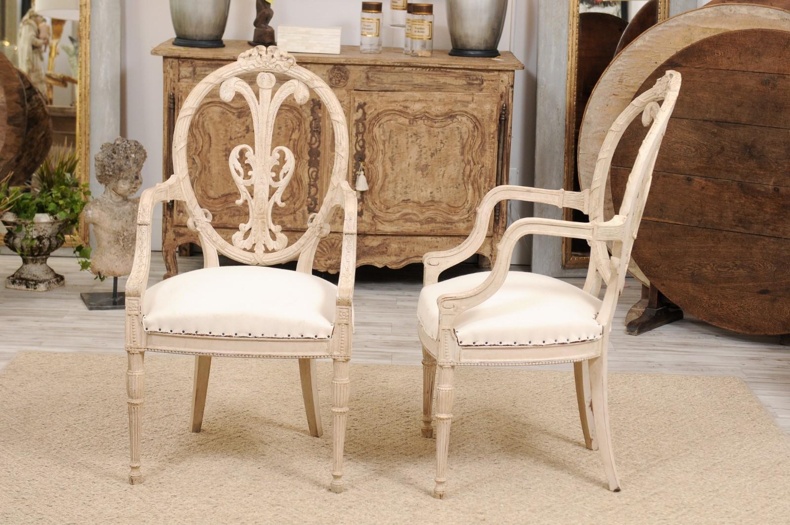 Carved Pair of French Louis XVI Style White Painted Oval Back Armchairs with Upholstery