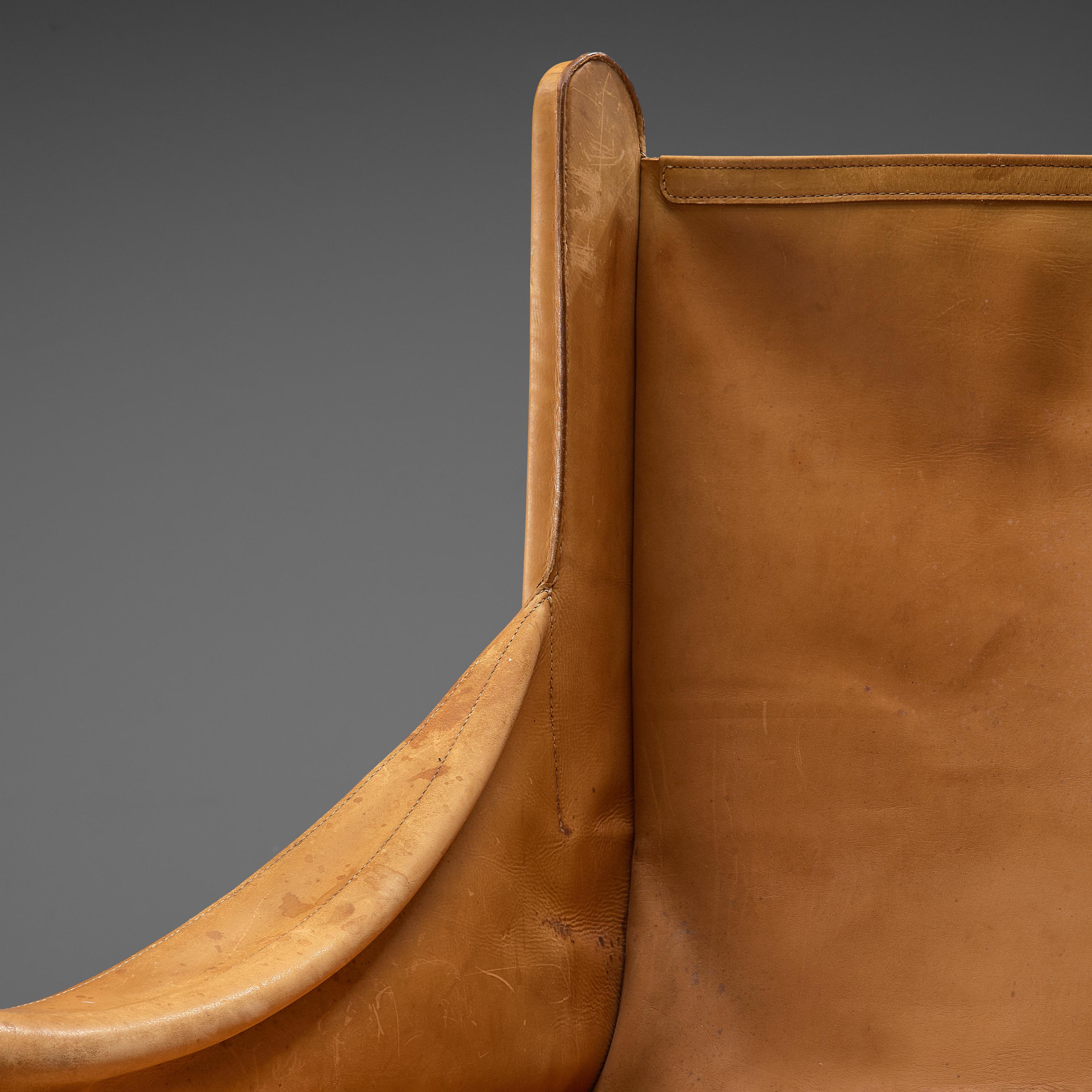 Mid-Century Modern Pair of French Lounge Chairs in Cognac Leather