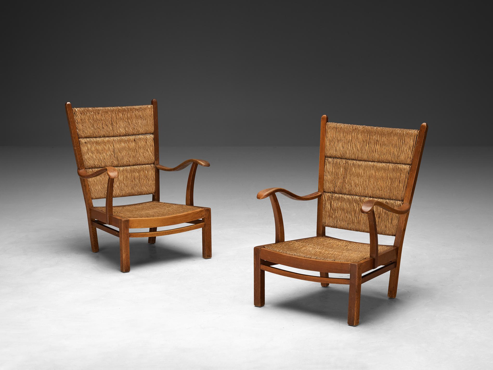 Pair of armchairs, straw, stained beech, The Netherlands, 1950s

These rustic armchairs originate from The Netherlands and epitomize an exquisite simplicity of remarkable quality. The straw backrests are made in three parts and show horizontal